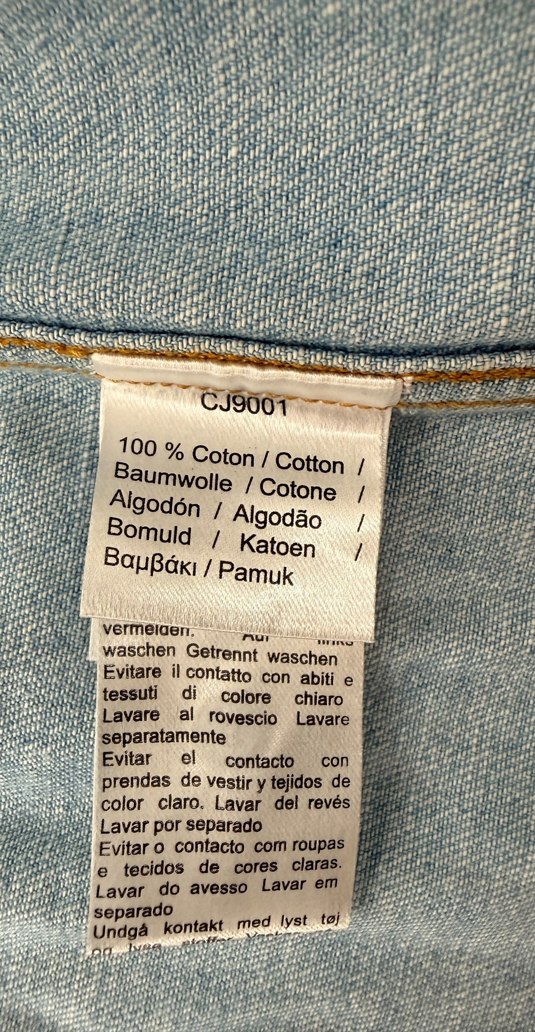 Authentic Lacoste kids denim overshirt in size 8 featuring snap-button closure, chest pockets, and classic crocodile logo. Light wash designer children’s wear.