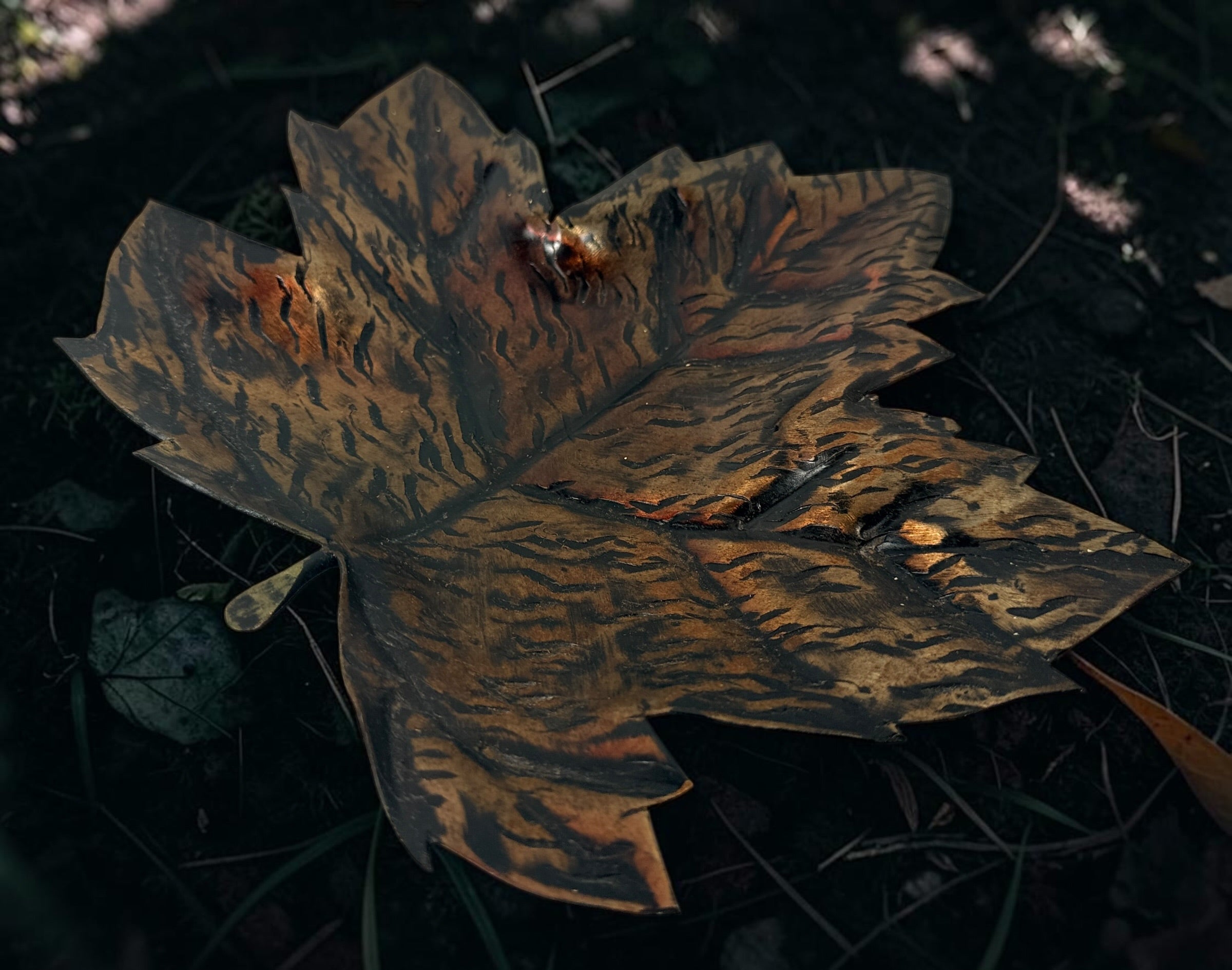 Authentic Au Fer Forge handcrafted maple leaf iron tray from Quebec. Vintage brutalist Canadian metalwork with original label and flame patina finish.