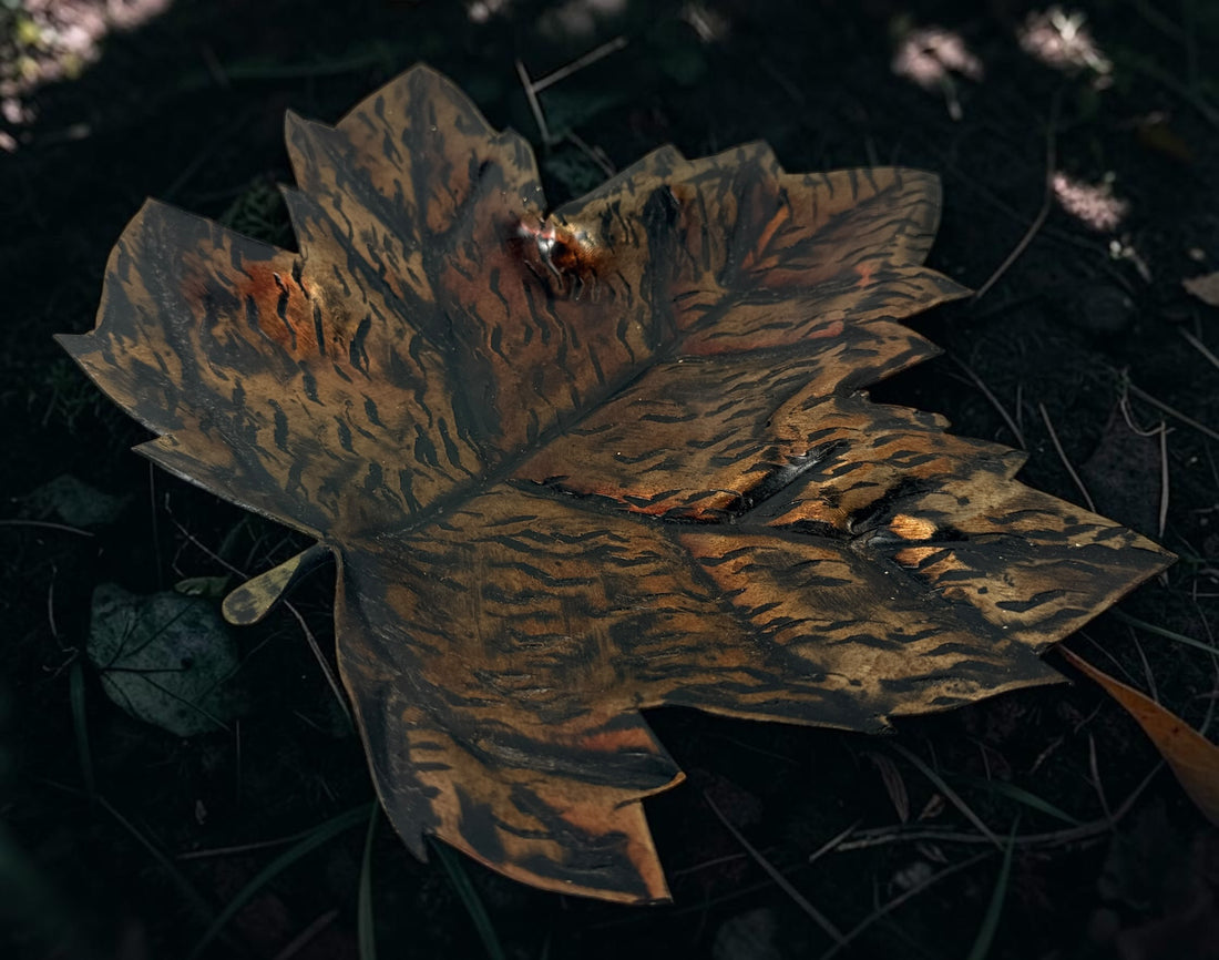 Authentic Au Fer Forge handcrafted maple leaf iron tray from Quebec. Vintage brutalist Canadian metalwork with original label and flame patina finish.