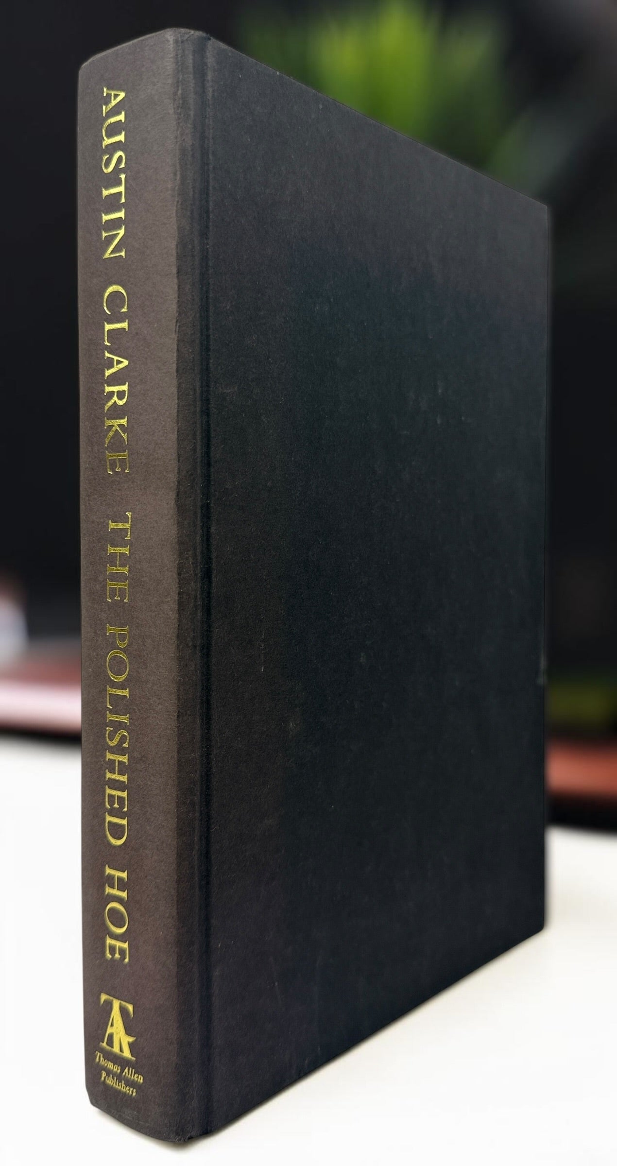 Signed Austin Clarke The Polished Hoe hardcover novel from 2002. Inscribed by the author and dated publication year. Collectible Canadian literary first-era edition.
