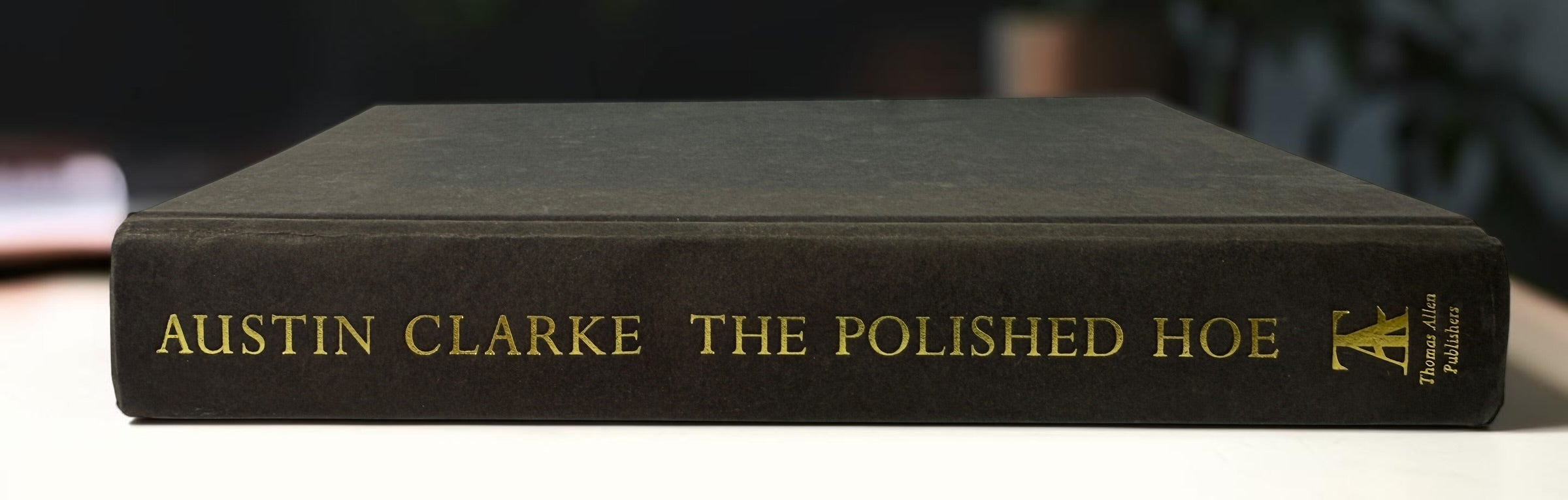 Signed Austin Clarke The Polished Hoe hardcover novel from 2002. Inscribed by the author and dated publication year. Collectible Canadian literary first-era edition.