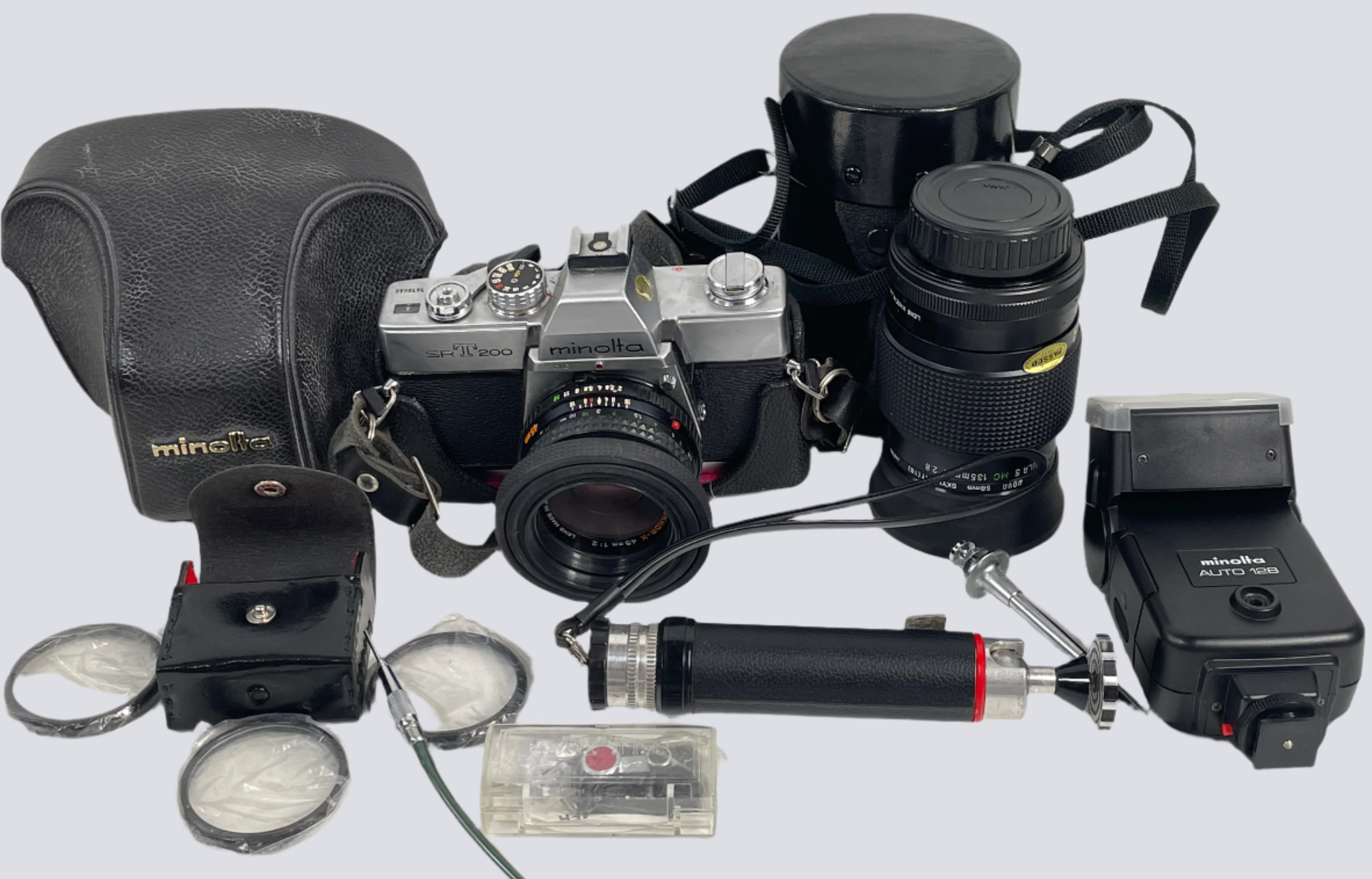 Minolta SR-T 200 Film Camera Kit – 2 Lenses (45mm & 135mm) + Flash, Filters, Grip, Shutter Cable