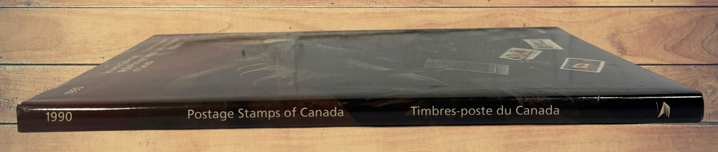 Complete Canada Post 1990 Souvenir Collection album featuring original Canadian stamps, bilingual content, historical notes, and philatelic reference material.