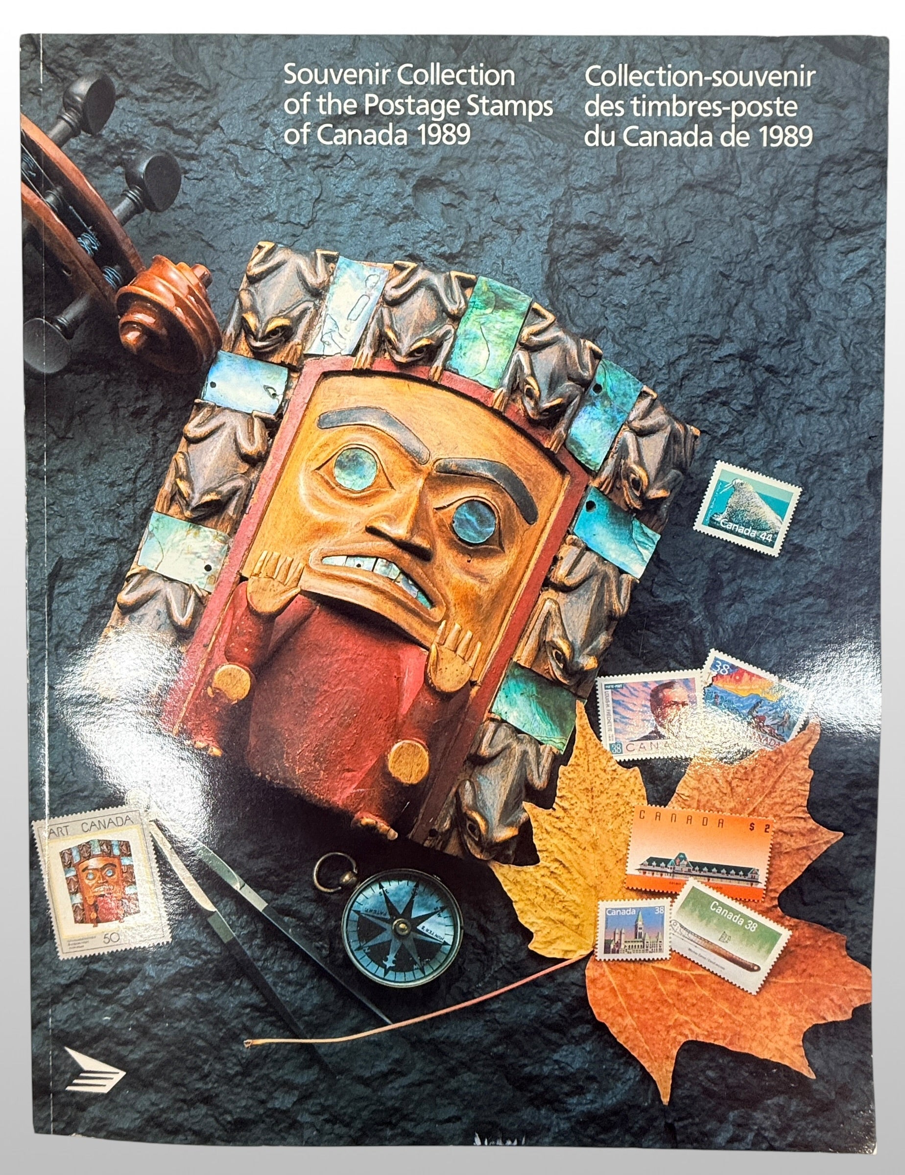 Official Canada Post 1989 stamp collection album featuring complete mounted Canadian postage stamps with bilingual descriptions and philatelic reference material.