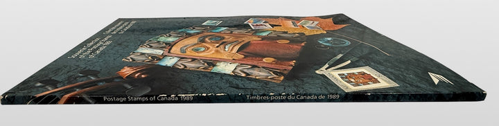 Official Canada Post 1989 stamp collection album featuring complete mounted Canadian postage stamps with bilingual descriptions and philatelic reference material.