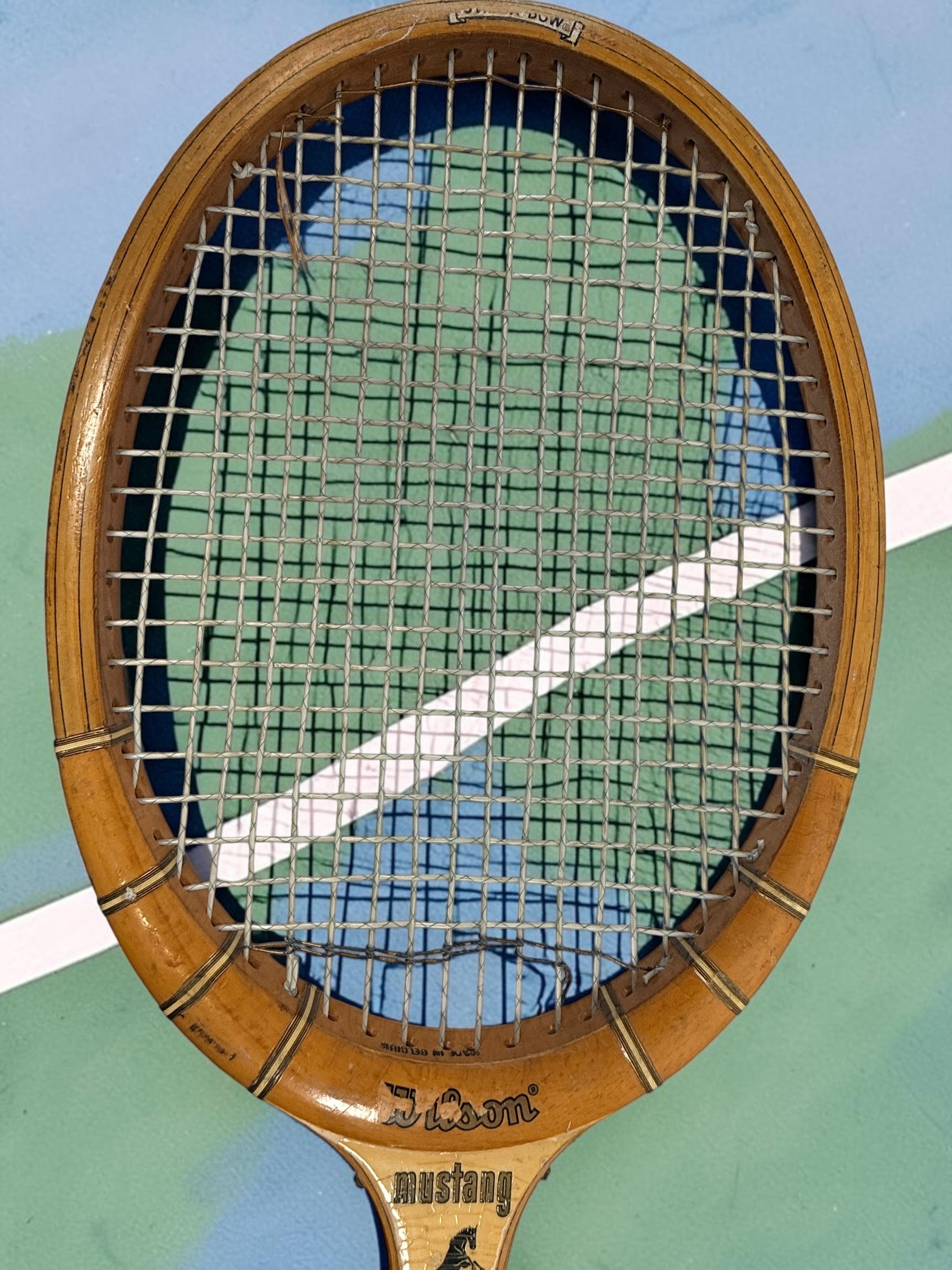 Vintage Wilson Mustang wooden tennis racket with Speed Flex Fibre Face construction. Classic mid-century tennis memorabilia and decorative sports display piece.