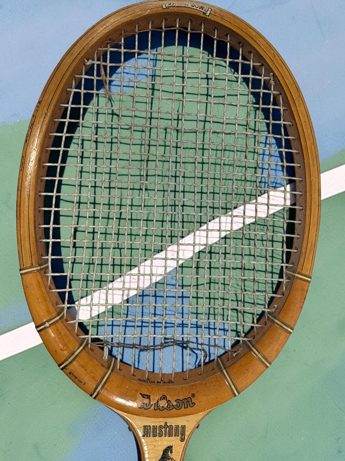Vintage Wilson Mustang wooden tennis racket with Speed Flex Fibre Face construction. Classic mid-century tennis memorabilia and decorative sports display piece.