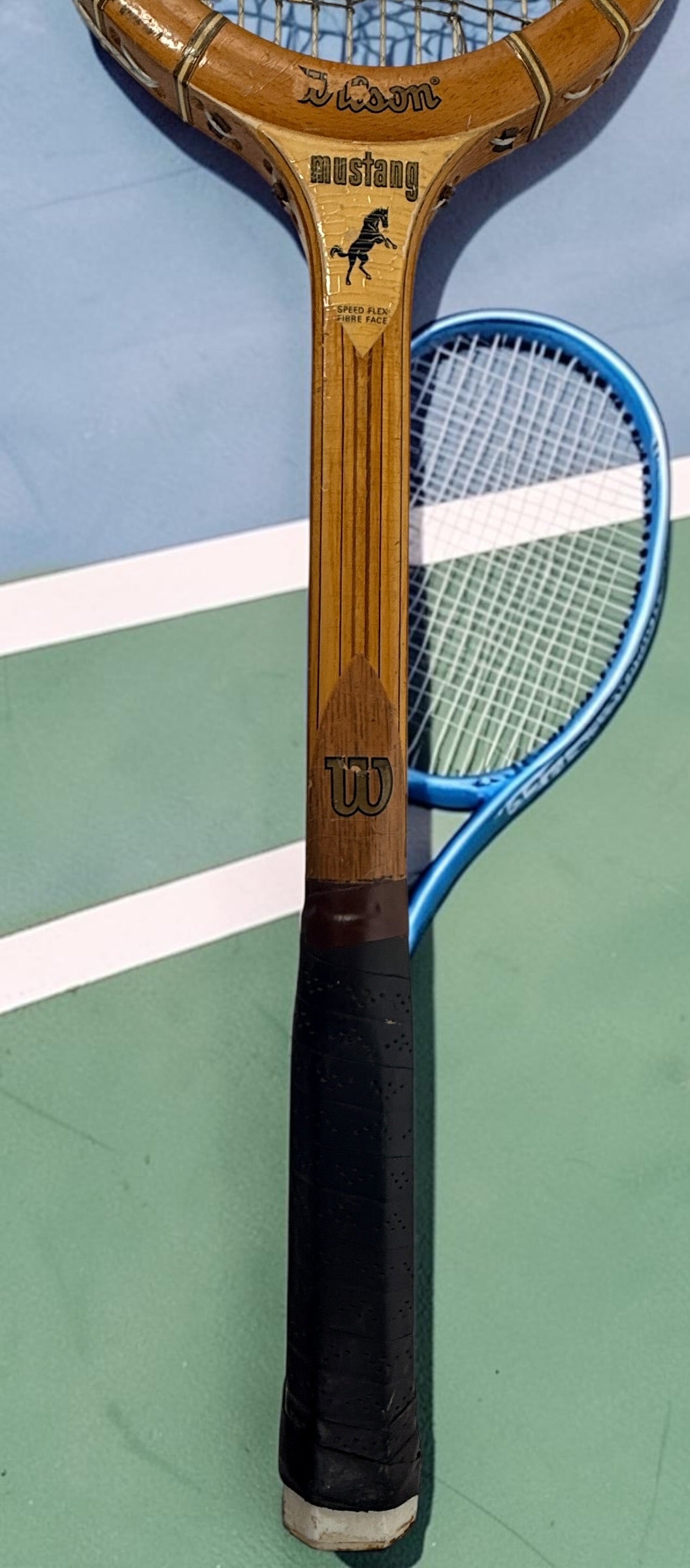 Vintage Wilson Mustang wooden tennis racket with Speed Flex Fibre Face construction. Classic mid-century tennis memorabilia and decorative sports display piece.