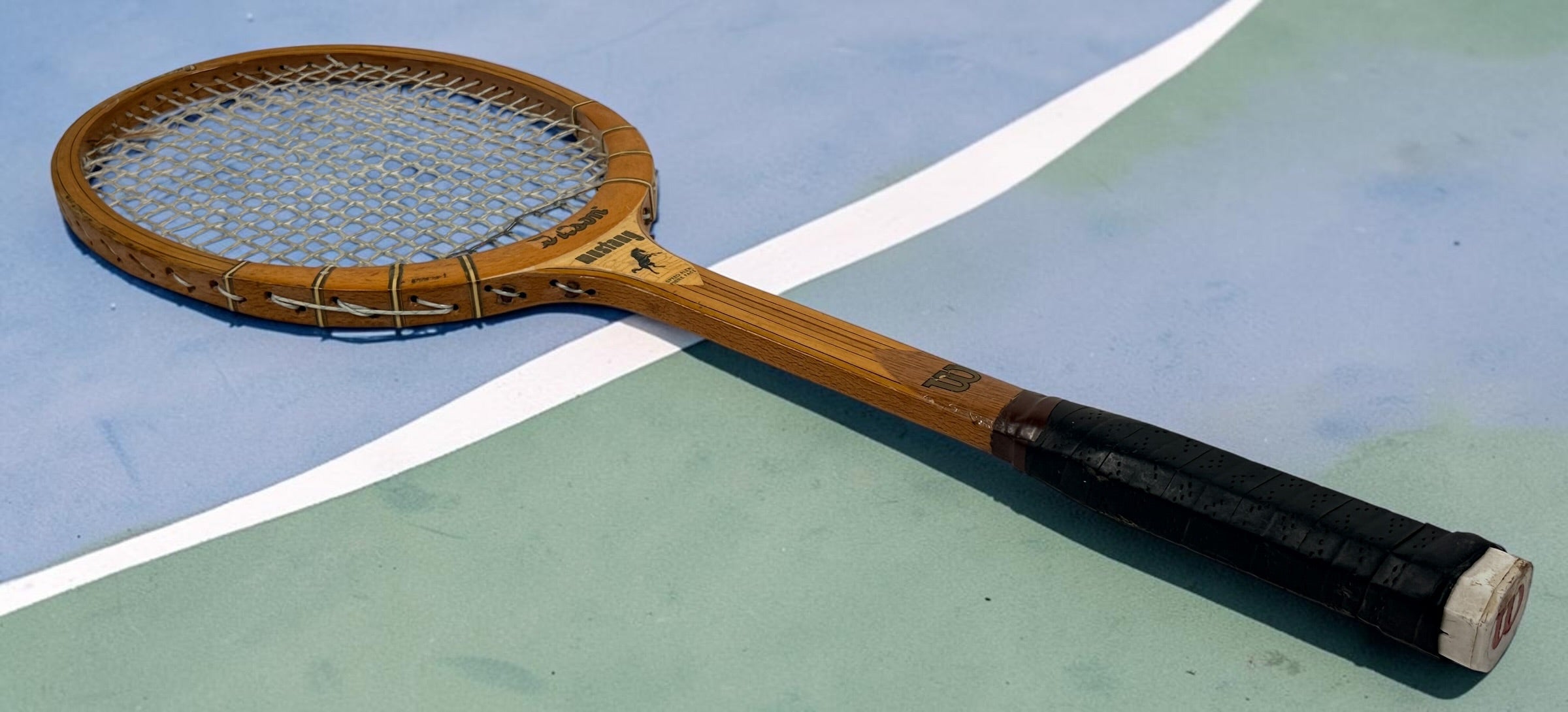 Vintage Wilson Mustang wooden tennis racket with Speed Flex Fibre Face construction. Classic mid-century tennis memorabilia and decorative sports display piece.