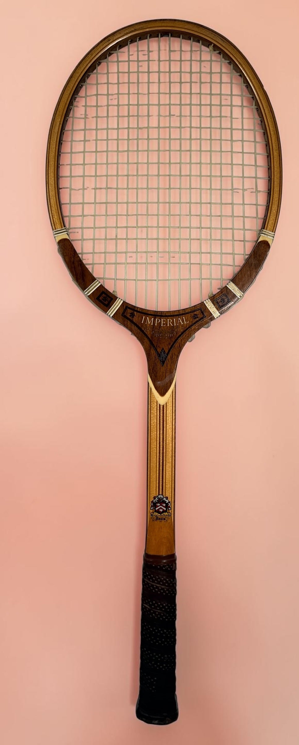 Vintage T.A. Davis Imperial wooden tennis racket made in the USA. Classic laminated hardwood racket with original grip and strings, ideal for collectors and décor.