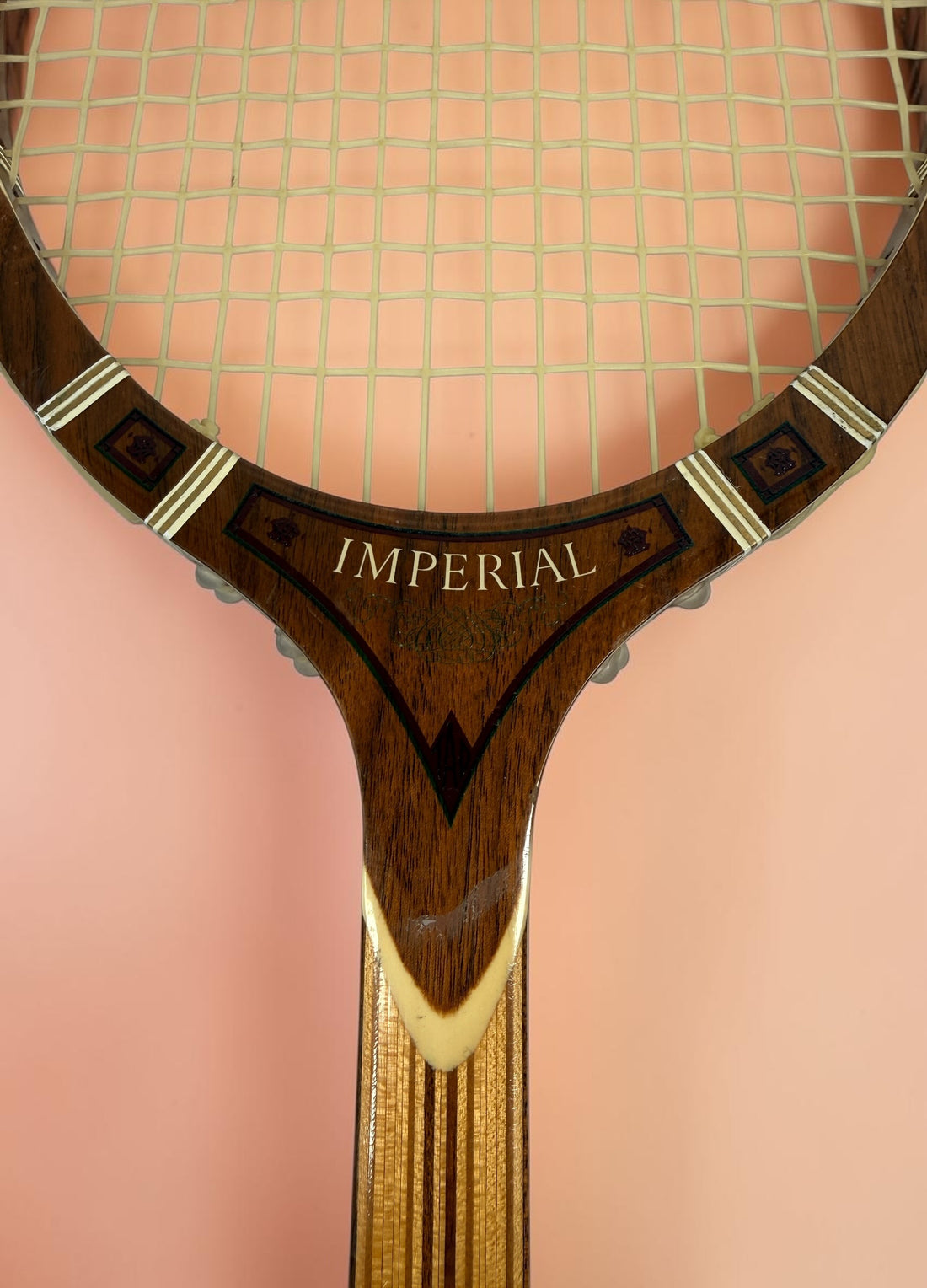 Vintage T.A. Davis Imperial wooden tennis racket made in the USA. Classic laminated hardwood racket with original grip and strings, ideal for collectors and décor.