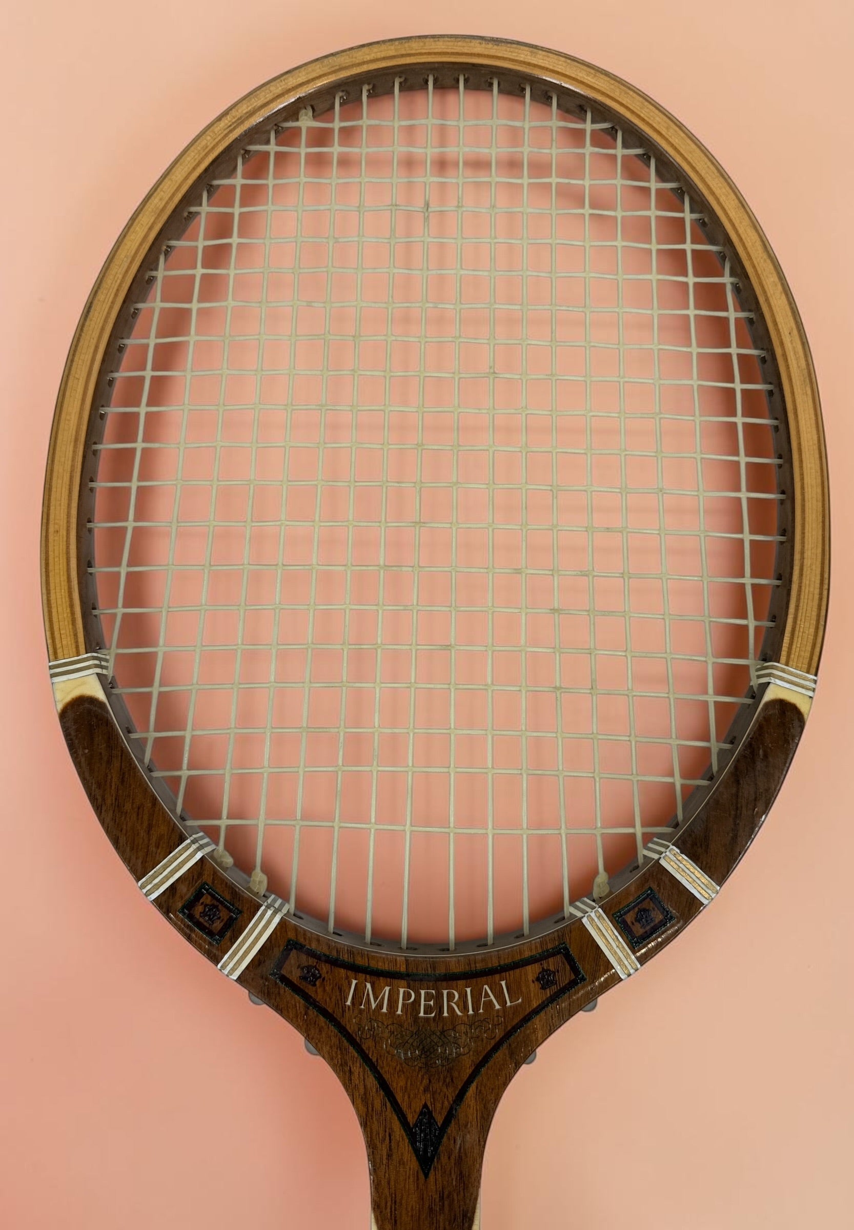 Vintage T.A. Davis Imperial wooden tennis racket made in the USA. Classic laminated hardwood racket with original grip and strings, ideal for collectors and décor.