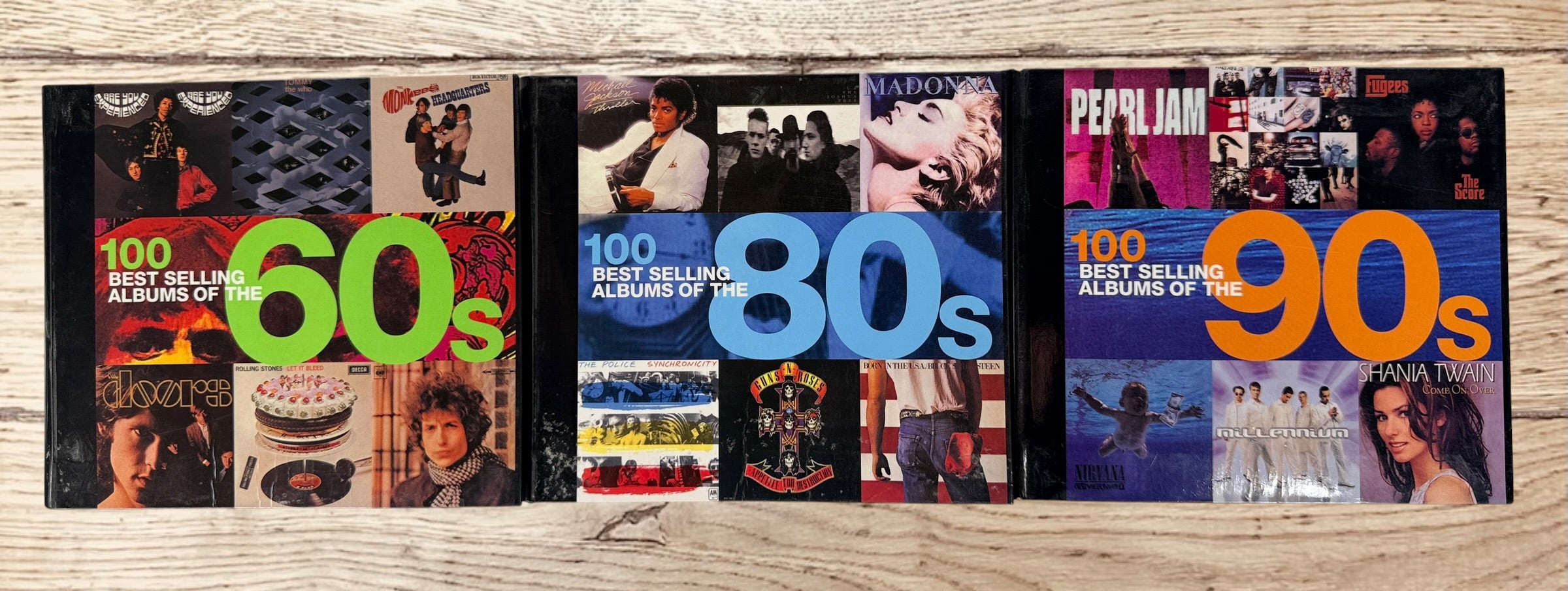 Complete 3-volume 100 Best Selling Albums book set covering the 1960s, 1980s and 1990s. Hardcover music reference books featuring iconic albums and artists.