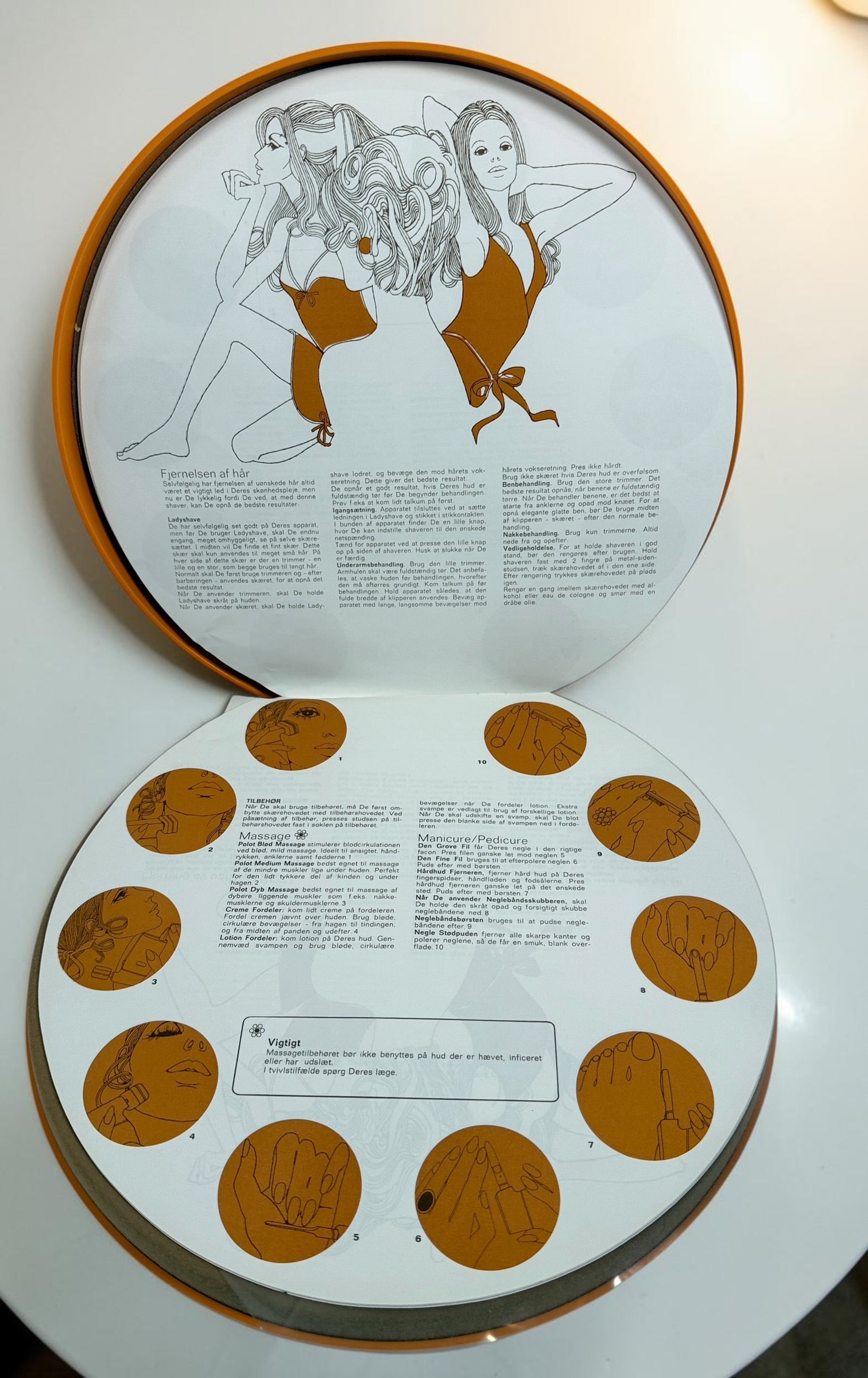 Vintage Philips Beauty Set from the early 1970s with original orange case, grooming accessories, paperwork, and Space Age styling. Complete collectible kit.