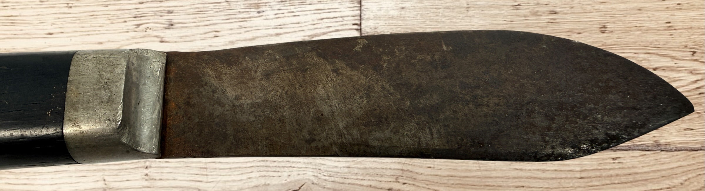 Antique buffalo skinner utility knife with carbon steel blade, hardwood handle, white-metal bolster, and original leather sheath. Classic hunting collectible.
