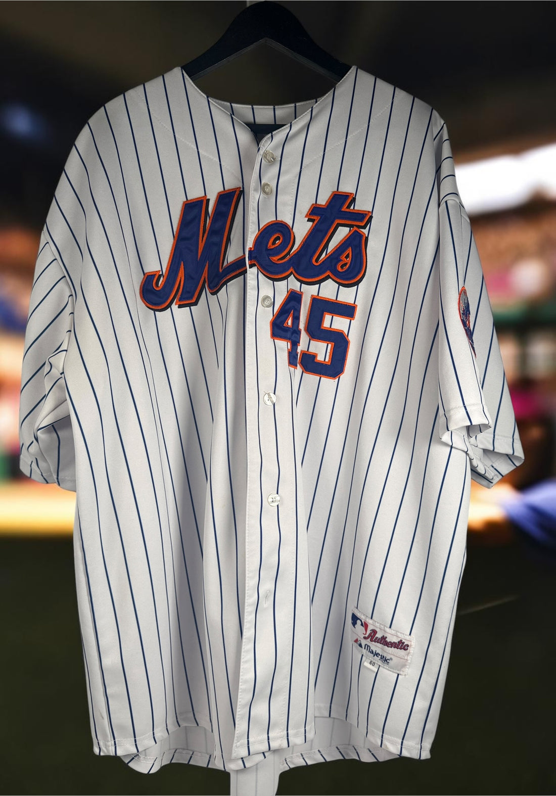 Authentic Majestic New York Mets Pedro Martinez #45 jersey in size XXL. Official MLB licensed pinstripe jersey with sewn graphics and Mets sleeve patch.