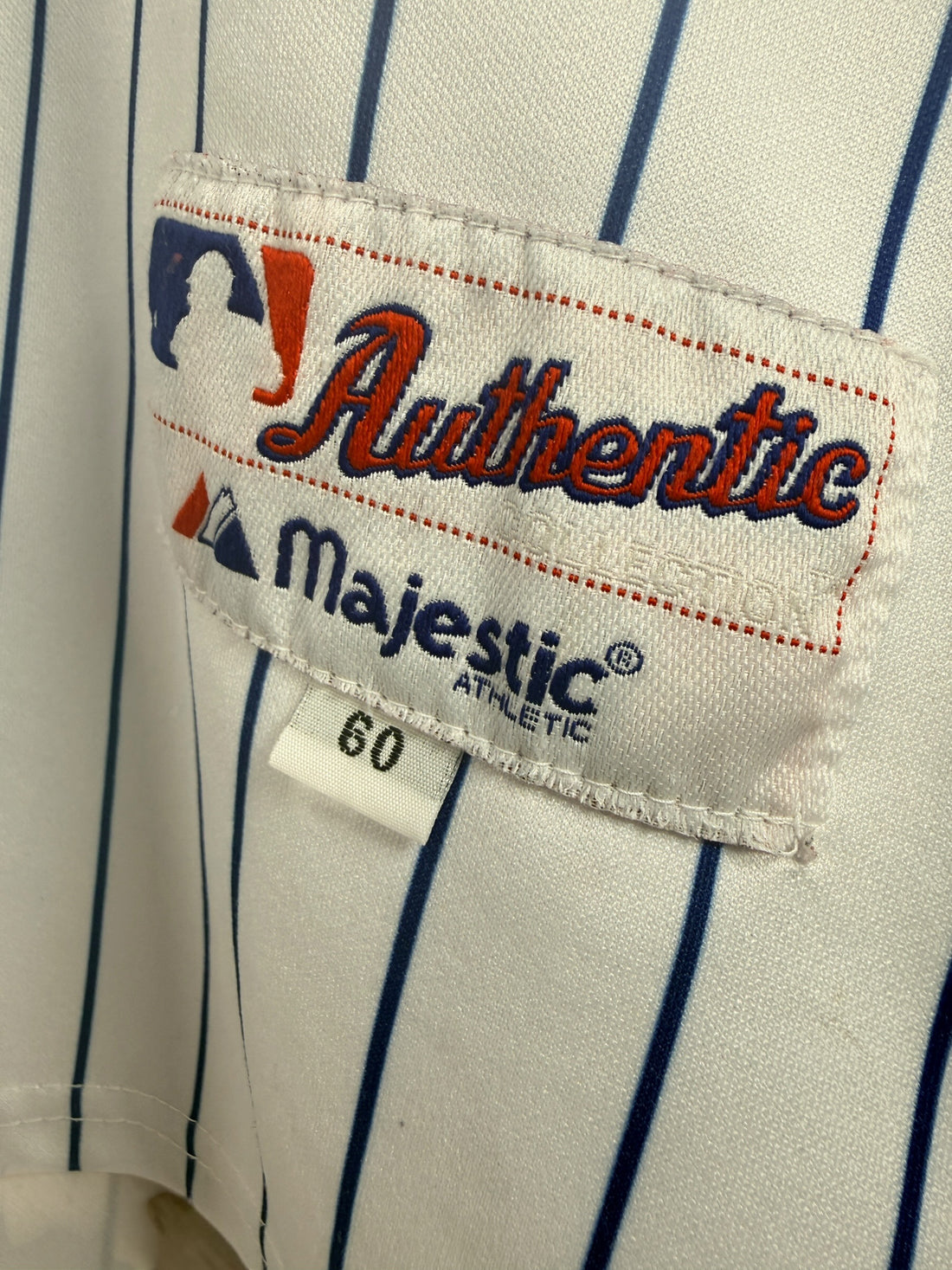 Authentic Majestic New York Mets Pedro Martinez #45 jersey in size XXL. Official MLB licensed pinstripe jersey with sewn graphics and Mets sleeve patch.
