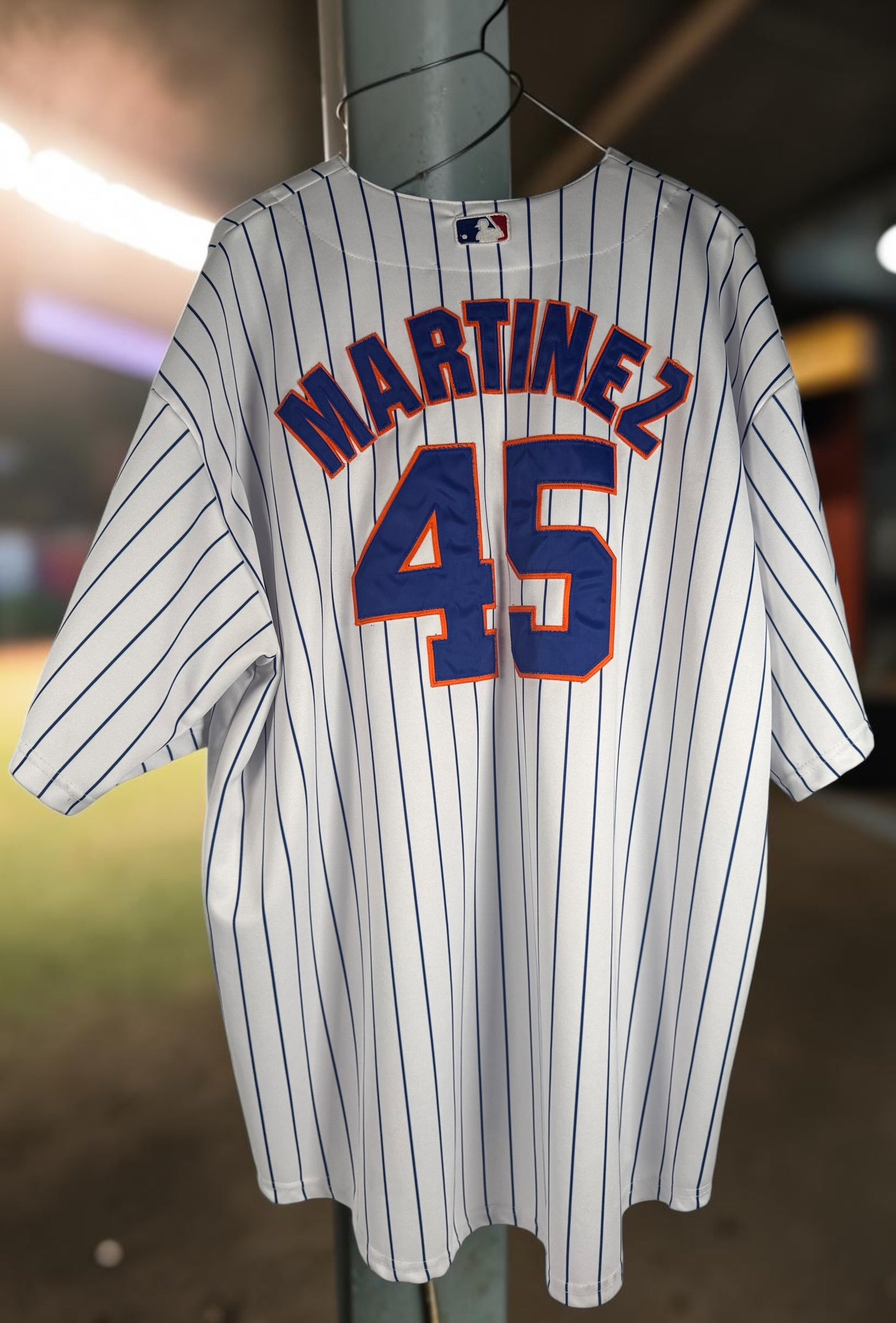 Authentic Majestic New York Mets Pedro Martinez #45 jersey in size XXL. Official MLB licensed pinstripe jersey with sewn graphics and Mets sleeve patch.