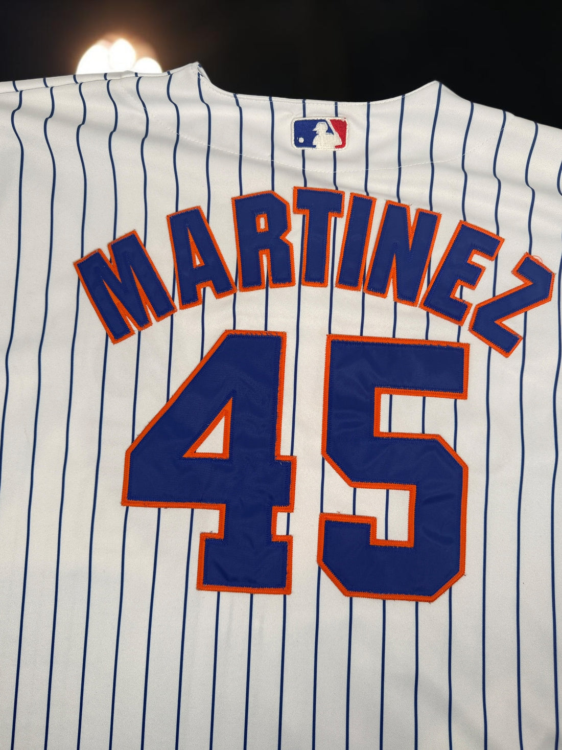 Authentic Majestic New York Mets Pedro Martinez #45 jersey in size XXL. Official MLB licensed pinstripe jersey with sewn graphics and Mets sleeve patch.