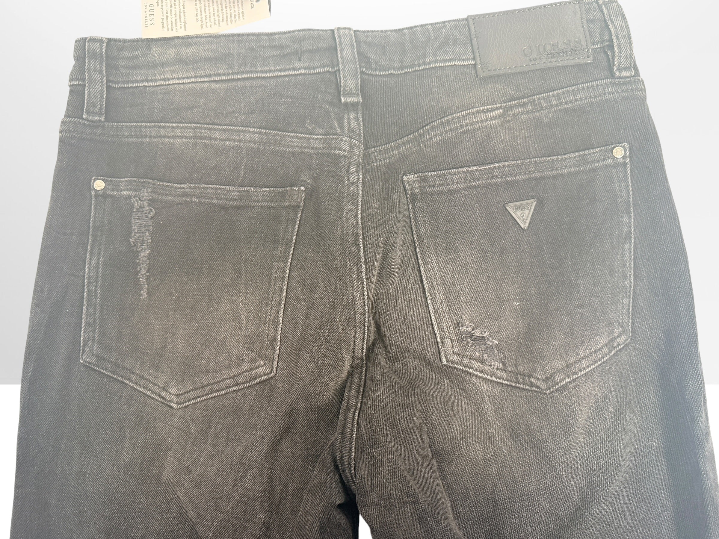 NWT GUESS The It Girl Skinny jeans in Glitter Punk wash. Black distressed stretch denim with shimmer finish, lace-up ankle details, and original tags, size 29.