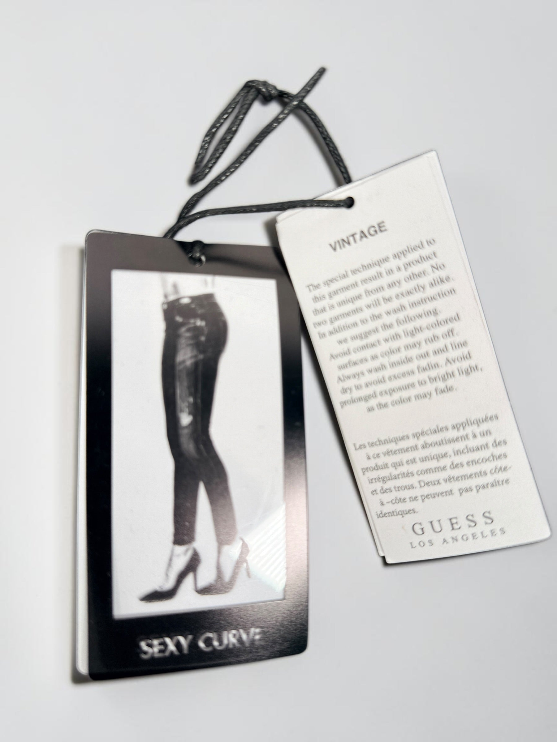 NWT GUESS Sexy Curve Skinny Mid jeans in black vintage wash featuring a lace-up front, stretch denim construction, and flattering curve fit. Size 29x27.