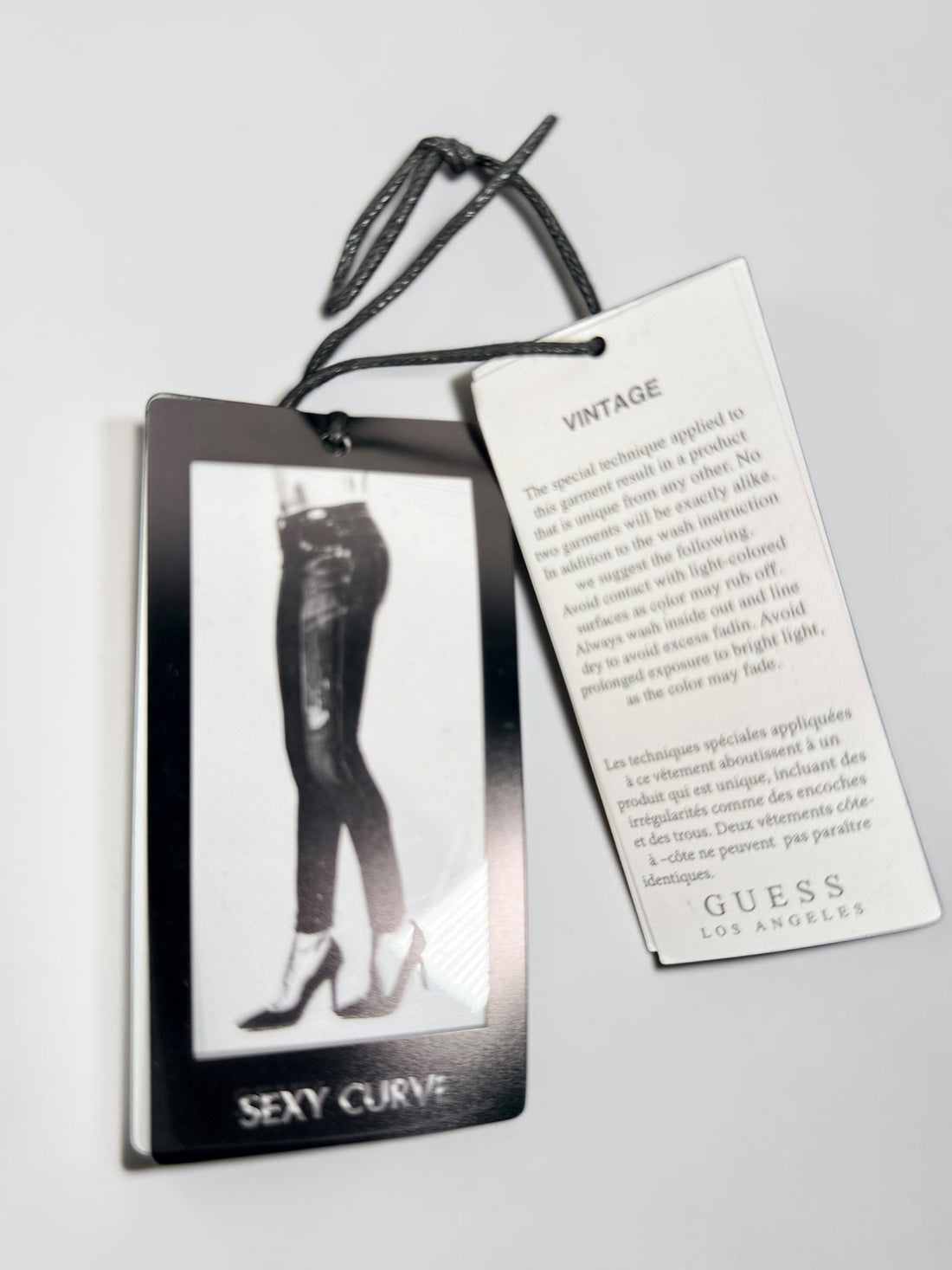 NWT GUESS Sexy Curve Skinny Mid jeans in black vintage wash featuring a lace-up front, stretch denim construction, and flattering curve fit. Size 29x27.