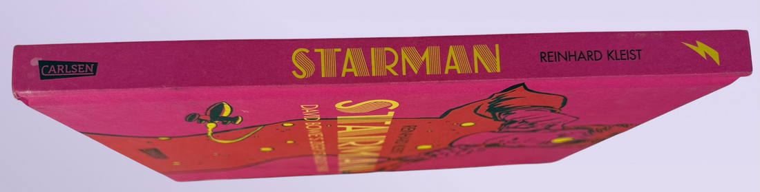 Reinhard Kleist’s Starman graphic novel chronicles David Bowie’s Ziggy Stardust years in stunning full color. German hardcover first edition from 2021.