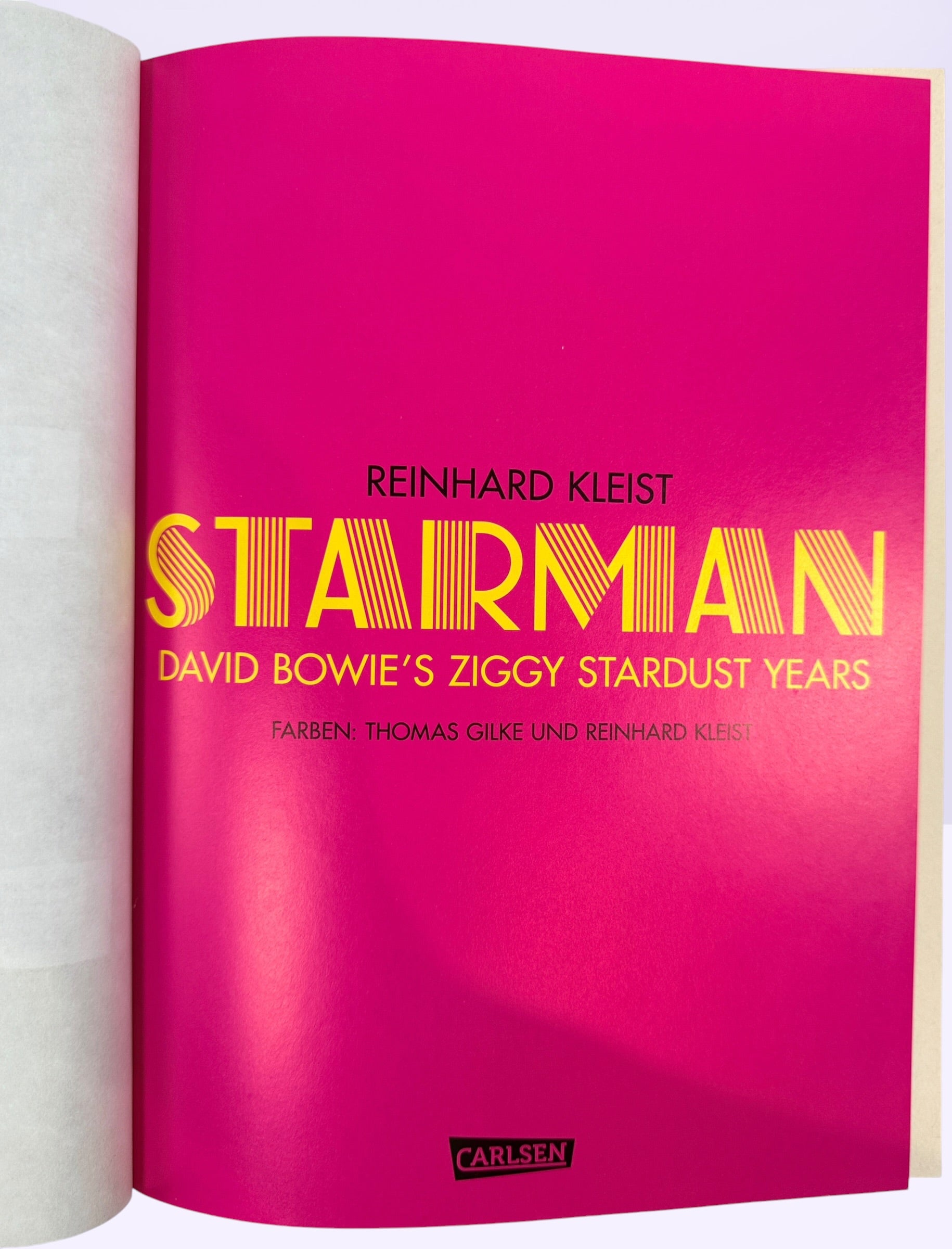 Reinhard Kleist’s Starman graphic novel chronicles David Bowie’s Ziggy Stardust years in stunning full color. German hardcover first edition from 2021.
