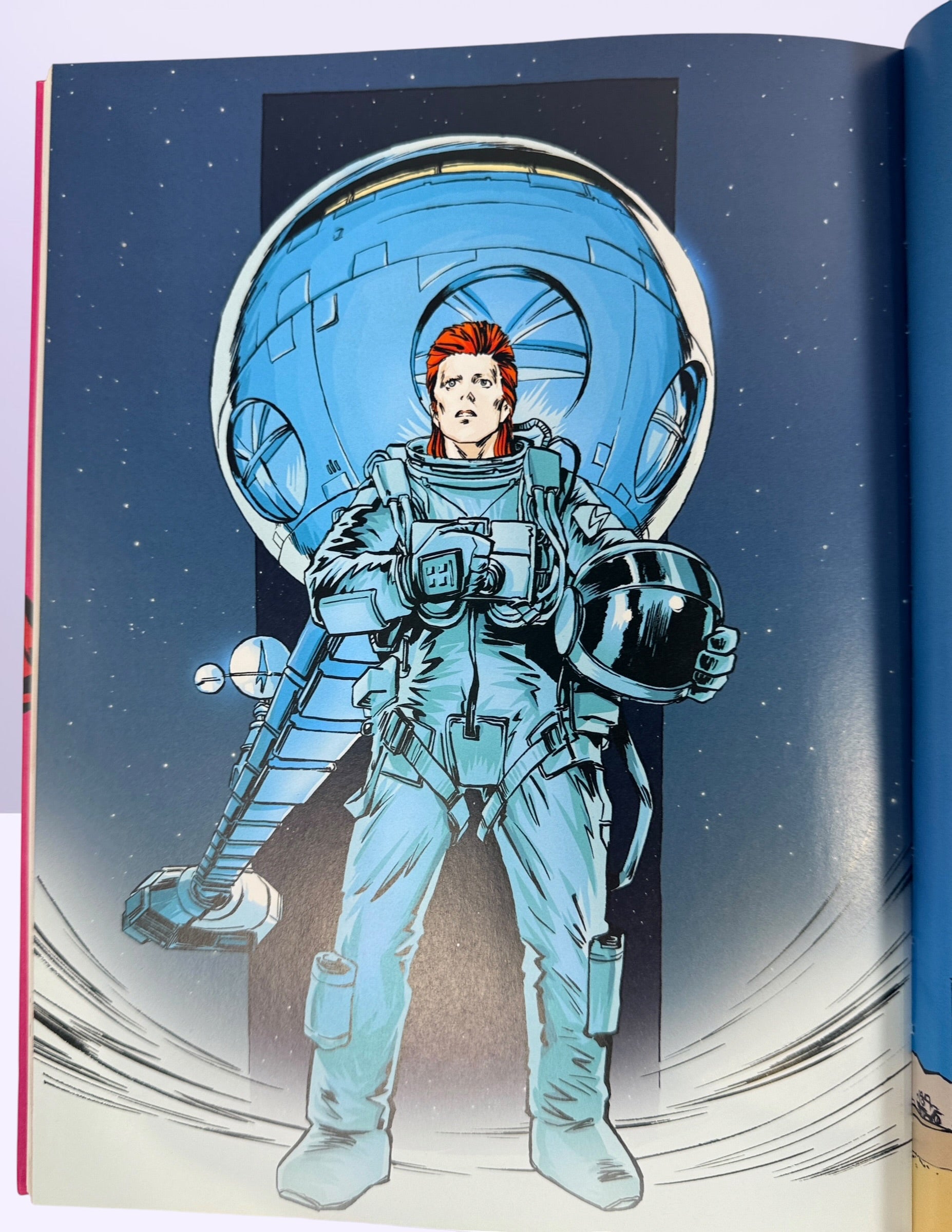 Reinhard Kleist’s Starman graphic novel chronicles David Bowie’s Ziggy Stardust years in stunning full color. German hardcover first edition from 2021.