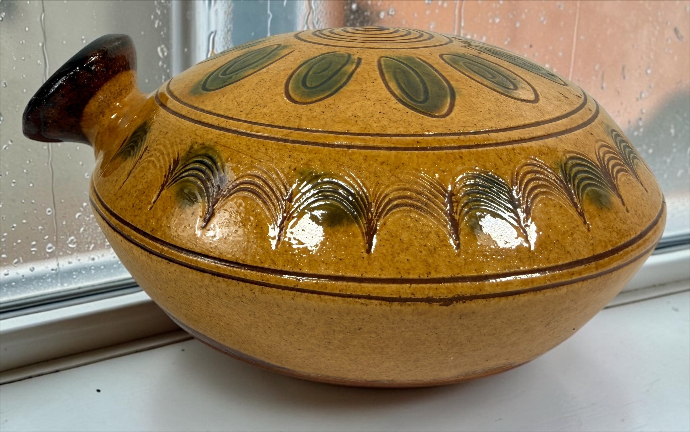Signed 1991 Troyan Bulgaria ceramic vessel with traditional folk art decoration, ochre glaze, incised motifs, and handcrafted studio pottery appeal.