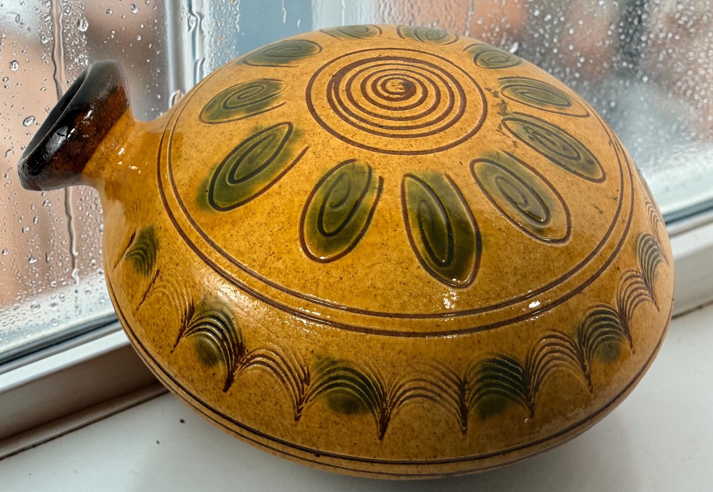 Signed 1991 Troyan Bulgaria ceramic vessel with traditional folk art decoration, ochre glaze, incised motifs, and handcrafted studio pottery appeal.