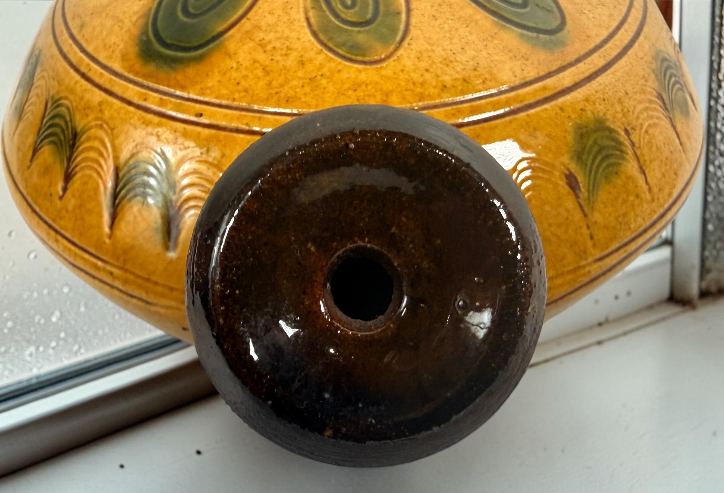 Signed 1991 Troyan Bulgaria ceramic vessel with traditional folk art decoration, ochre glaze, incised motifs, and handcrafted studio pottery appeal.