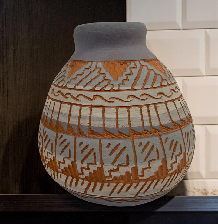 Signed S. Benaly Shiprock NM pottery vase featuring hand-carved Southwest geometric decoration. Vintage studio pottery from New Mexico.