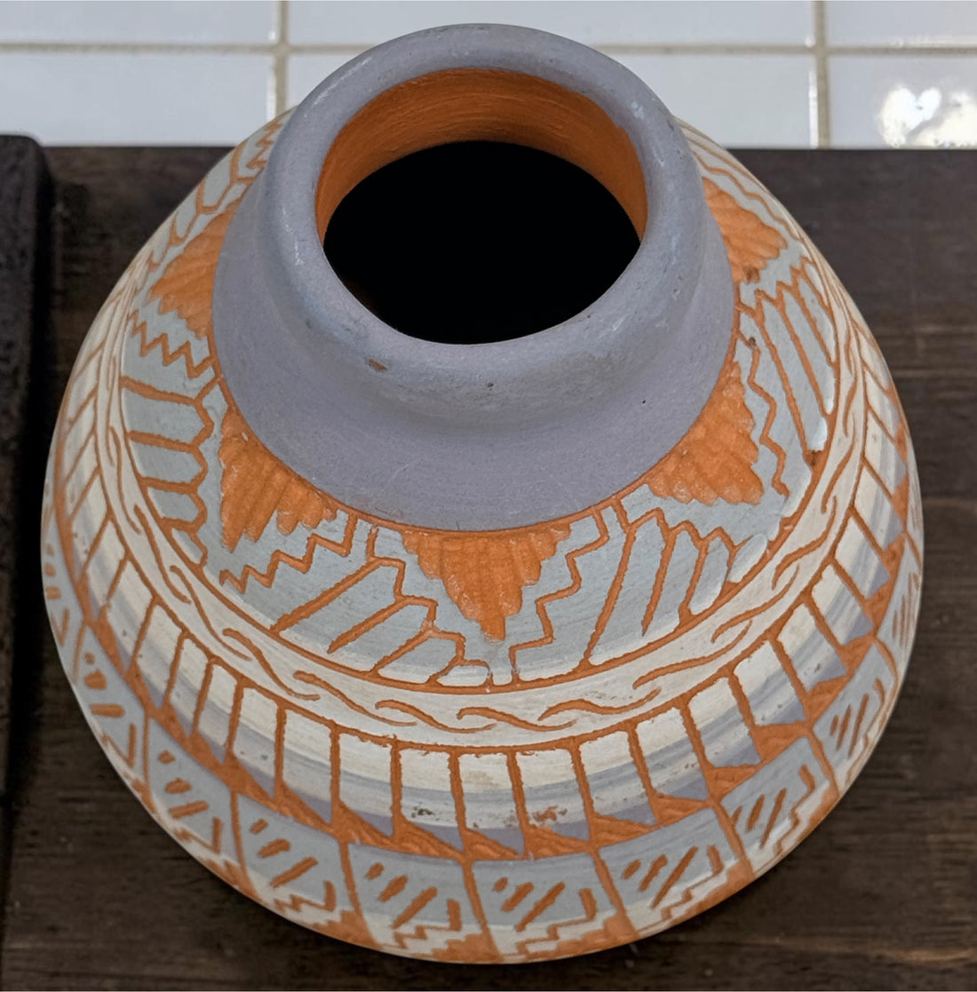 Signed S. Benaly Shiprock NM pottery vase featuring hand-carved Southwest geometric decoration. Vintage studio pottery from New Mexico.