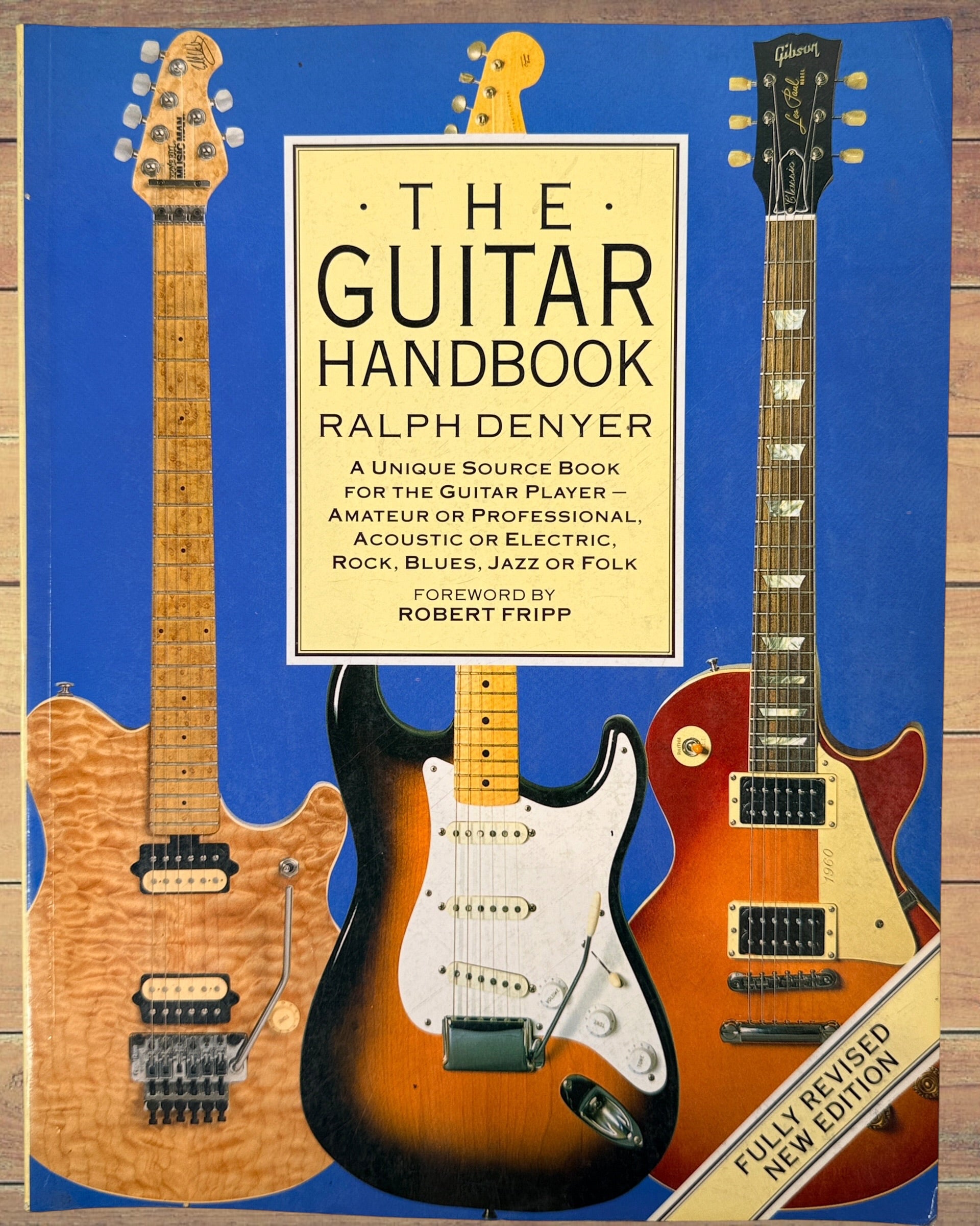 1993 revised edition of The Guitar Handbook by Ralph Denyer. Comprehensive guitar reference covering theory, chords, maintenance, history, and technique.