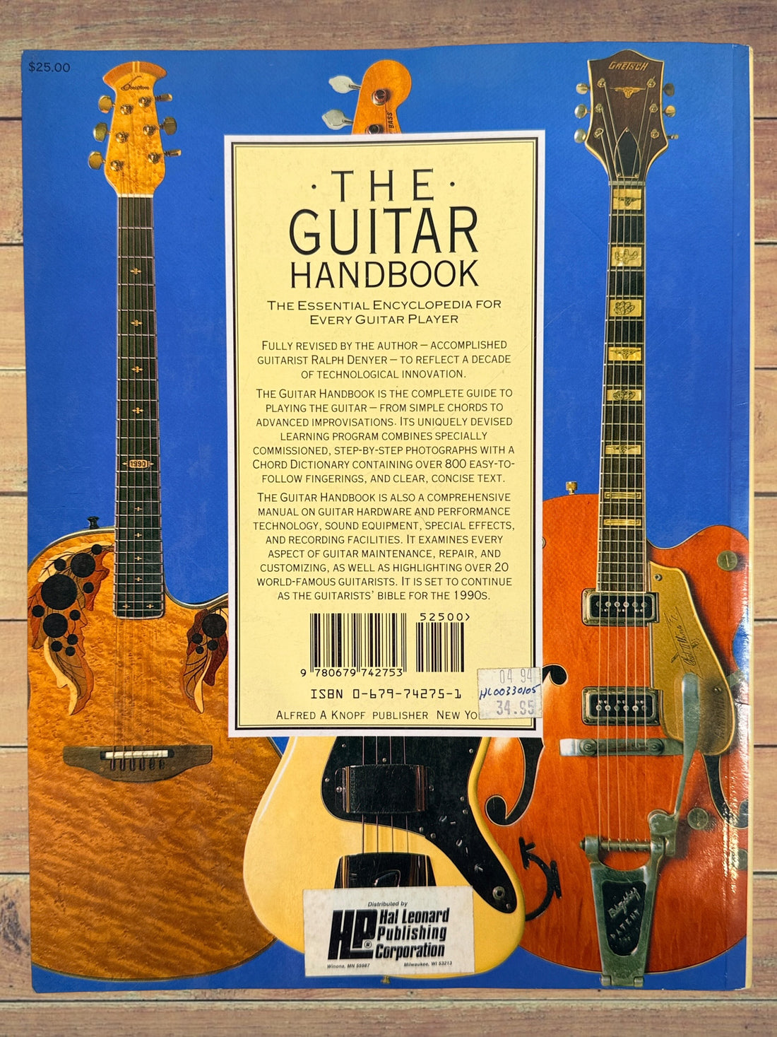 1993 revised edition of The Guitar Handbook by Ralph Denyer. Comprehensive guitar reference covering theory, chords, maintenance, history, and technique.