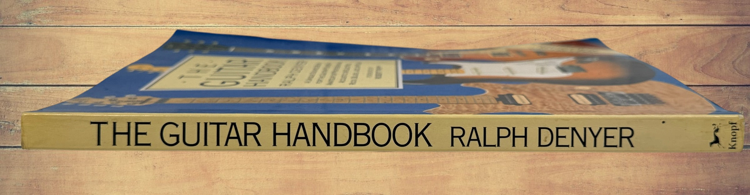 1993 revised edition of The Guitar Handbook by Ralph Denyer. Comprehensive guitar reference covering theory, chords, maintenance, history, and technique.