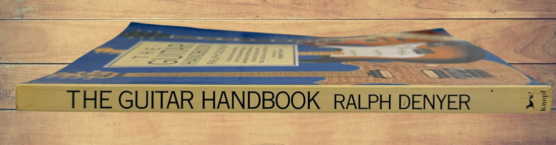 1993 revised edition of The Guitar Handbook by Ralph Denyer. Comprehensive guitar reference covering theory, chords, maintenance, history, and technique.