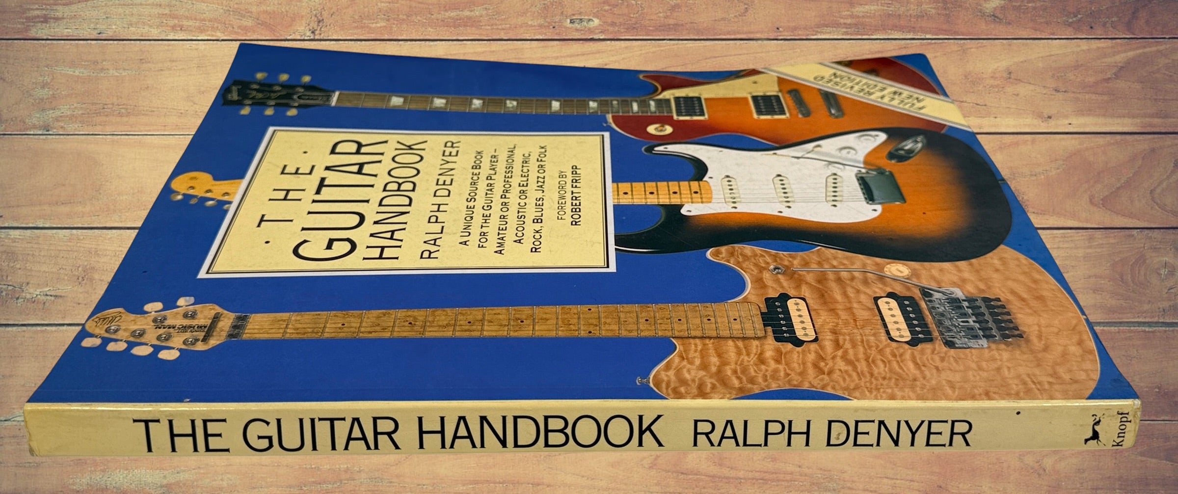 1993 revised edition of The Guitar Handbook by Ralph Denyer. Comprehensive guitar reference covering theory, chords, maintenance, history, and technique.