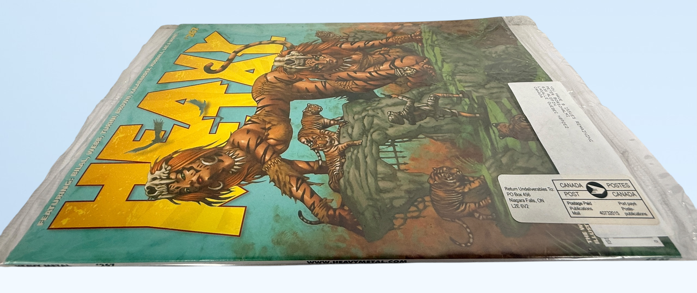 Heavy Metal Magazine #267 March 2014 factory sealed polybagged issue featuring Dave Wilkins cover art. Unread collectible with original insert included.