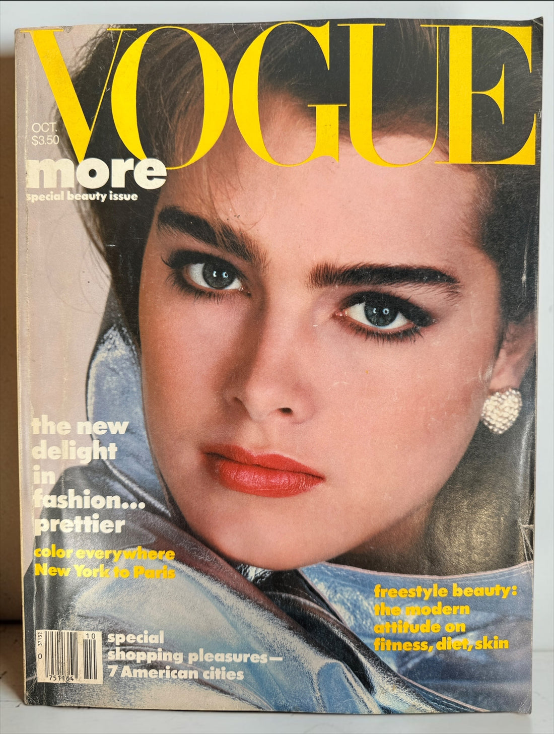 Vintage Vogue Magazine October 1984 featuring Brooke Shields on the cover. Special Beauty Issue with couture fashion, luxury advertising, and iconic 1980s style.