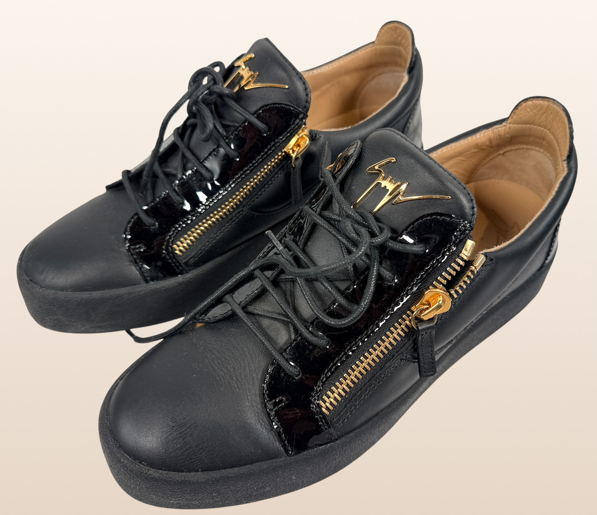 Authentic Giuseppe Zanotti black leather platform sneakers made in Italy featuring gold signature hardware, dual side zippers, leather lining, and rubber platform soles in EU 43.