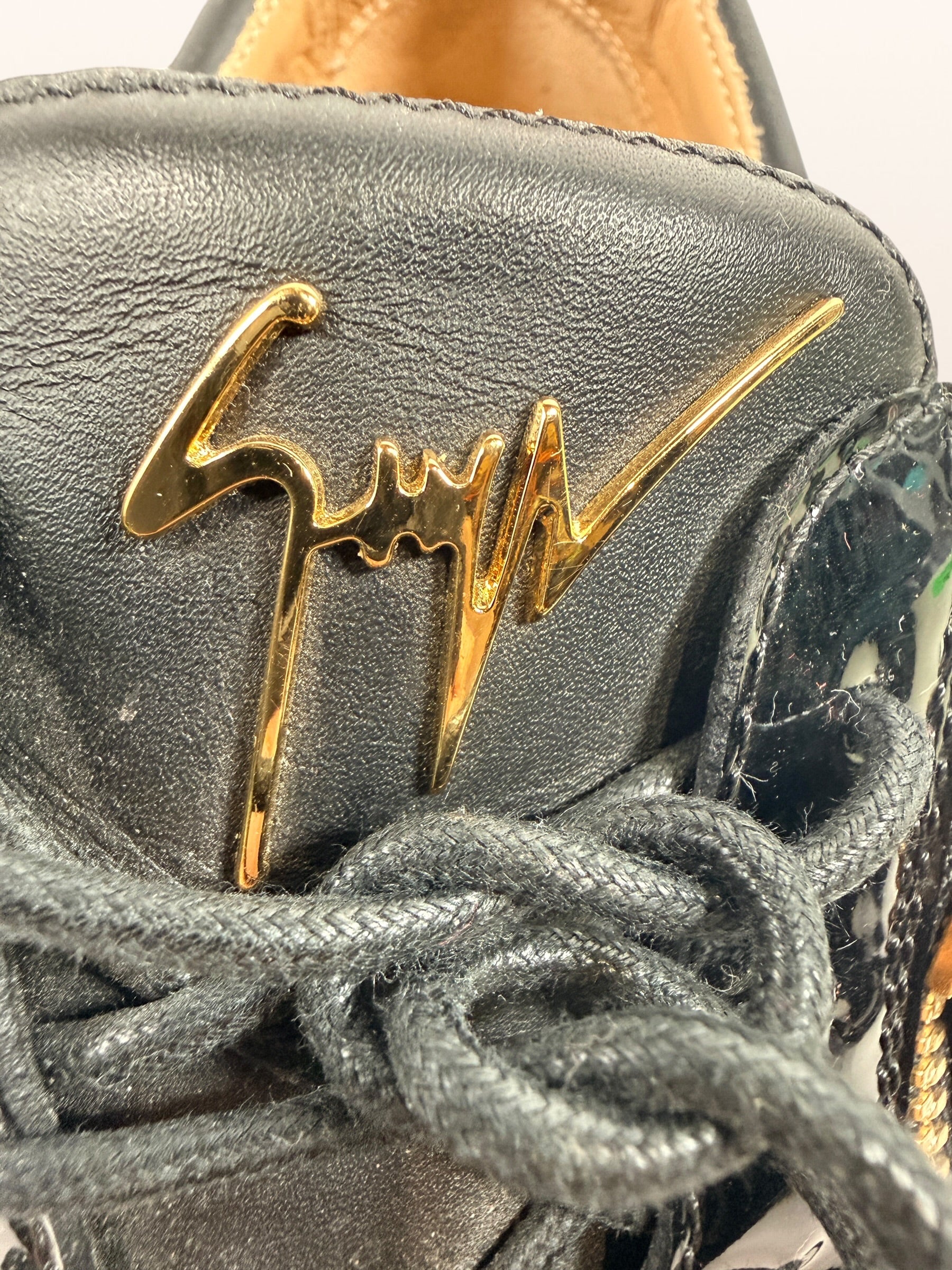 Authentic Giuseppe Zanotti black leather platform sneakers made in Italy featuring gold signature hardware, dual side zippers, leather lining, and rubber platform soles in EU 43.