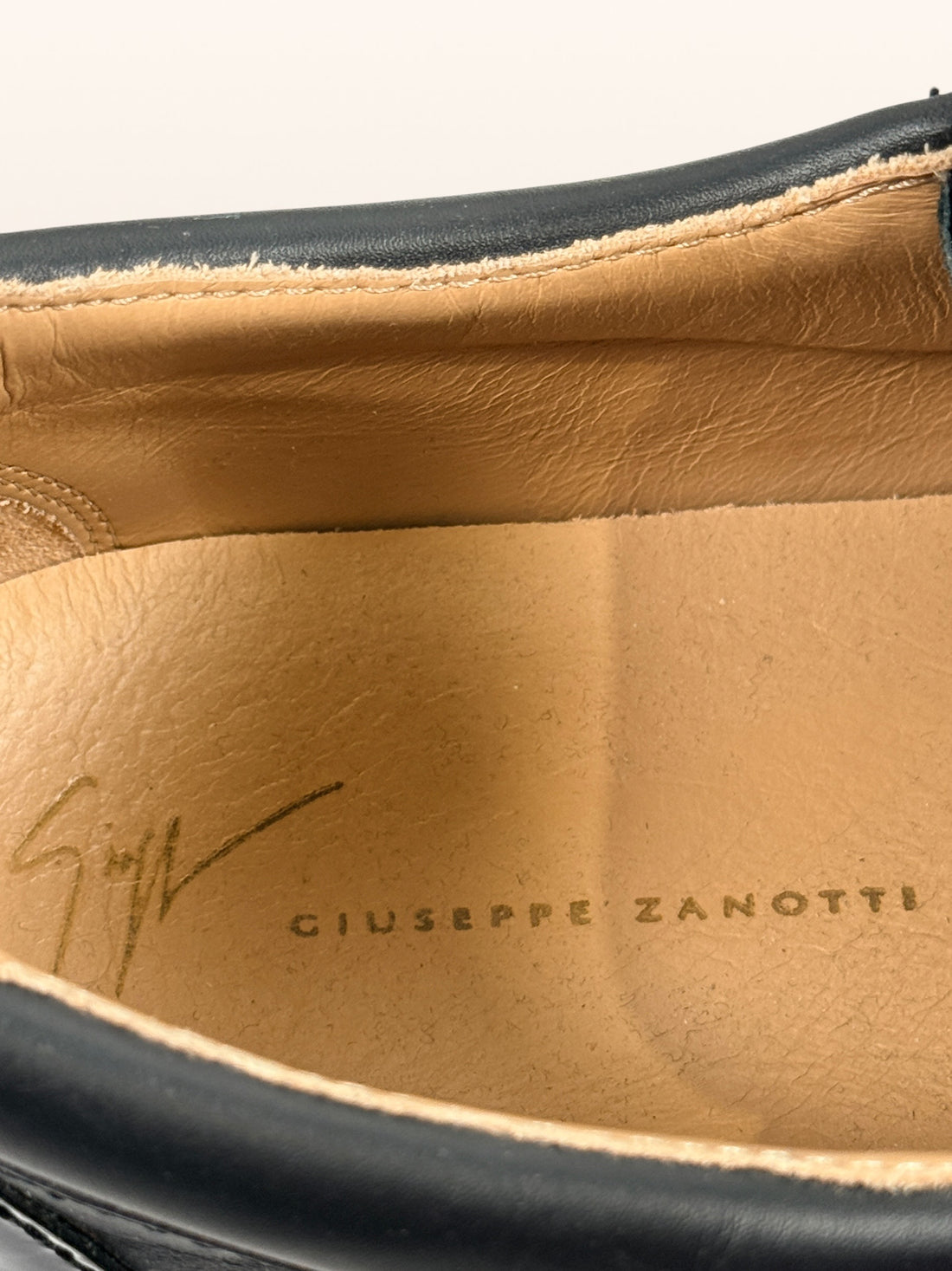Authentic Giuseppe Zanotti black leather platform sneakers made in Italy featuring gold signature hardware, dual side zippers, leather lining, and rubber platform soles in EU 43.