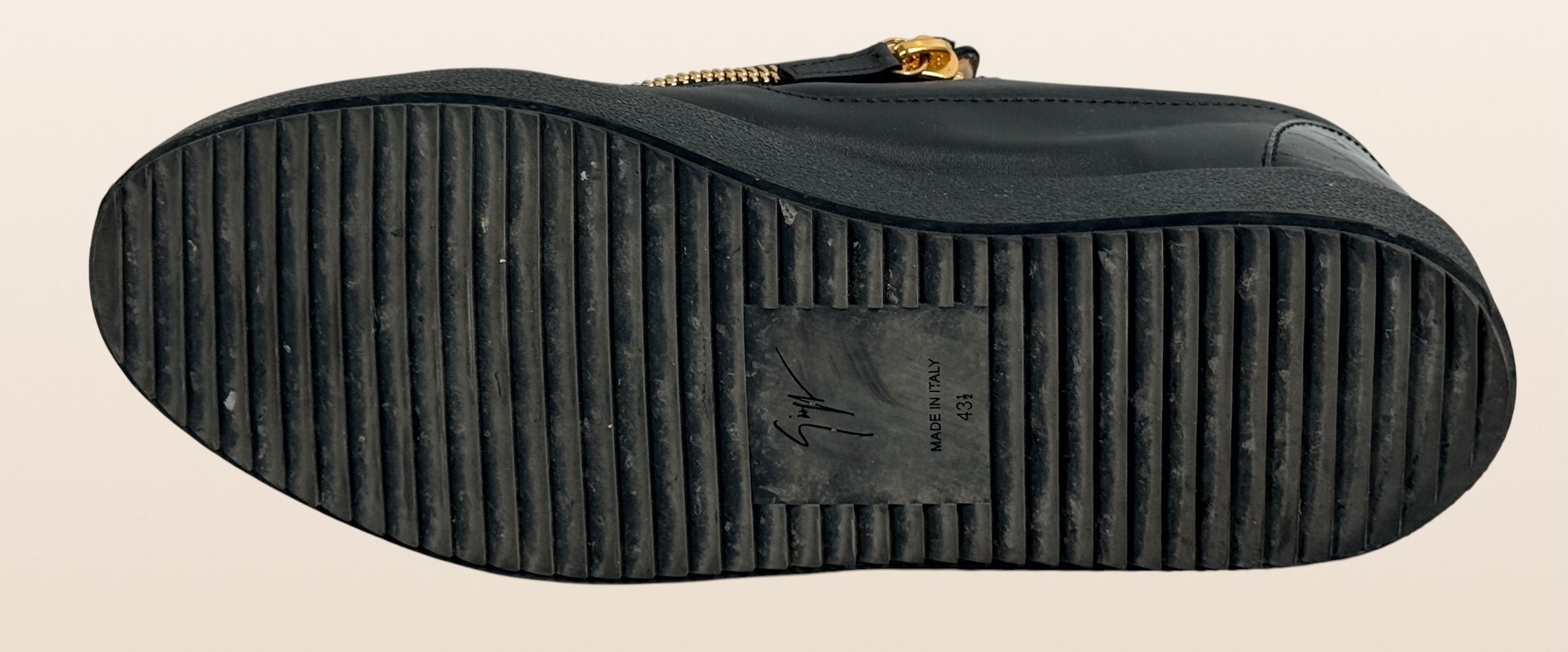 Authentic Giuseppe Zanotti black leather platform sneakers made in Italy featuring gold signature hardware, dual side zippers, leather lining, and rubber platform soles in EU 43.