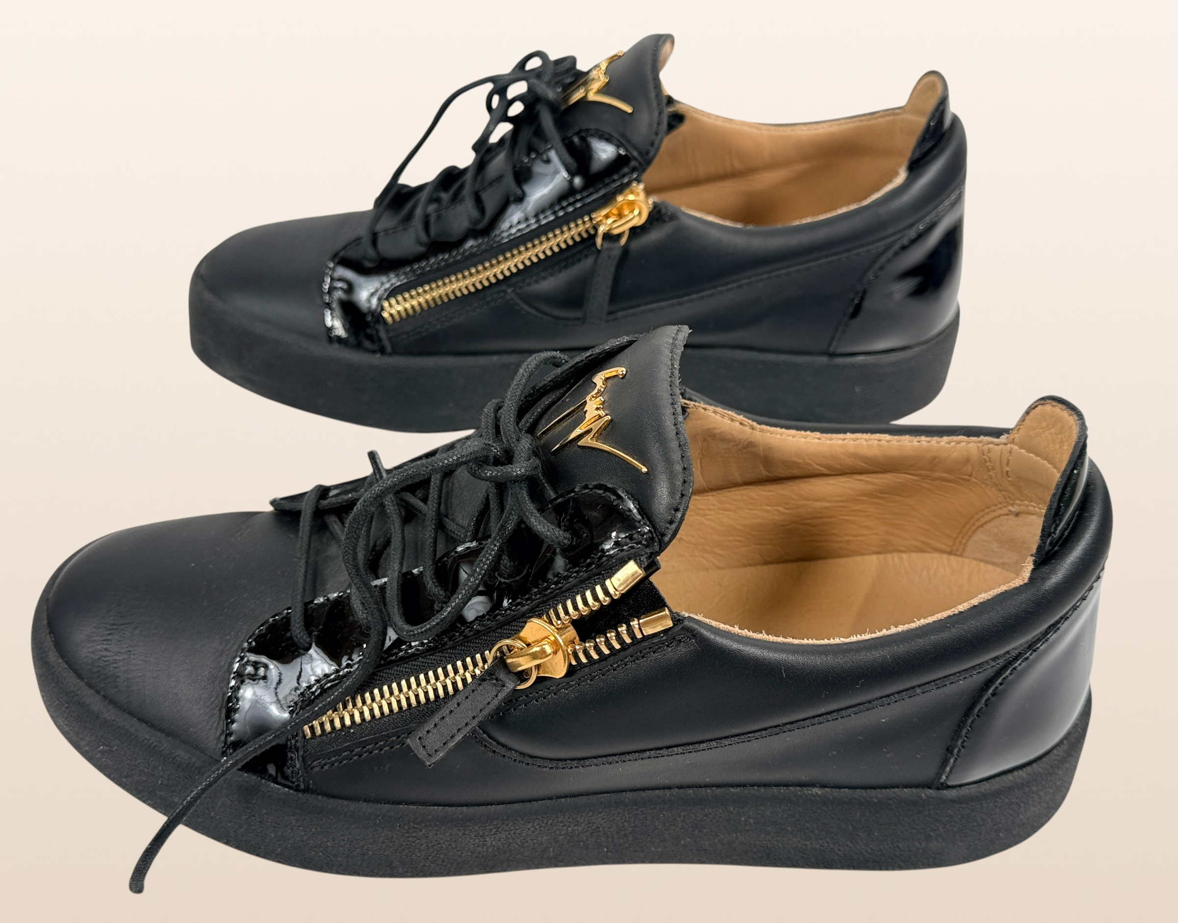Authentic Giuseppe Zanotti black leather platform sneakers made in Italy featuring gold signature hardware, dual side zippers, leather lining, and rubber platform soles in EU 43.