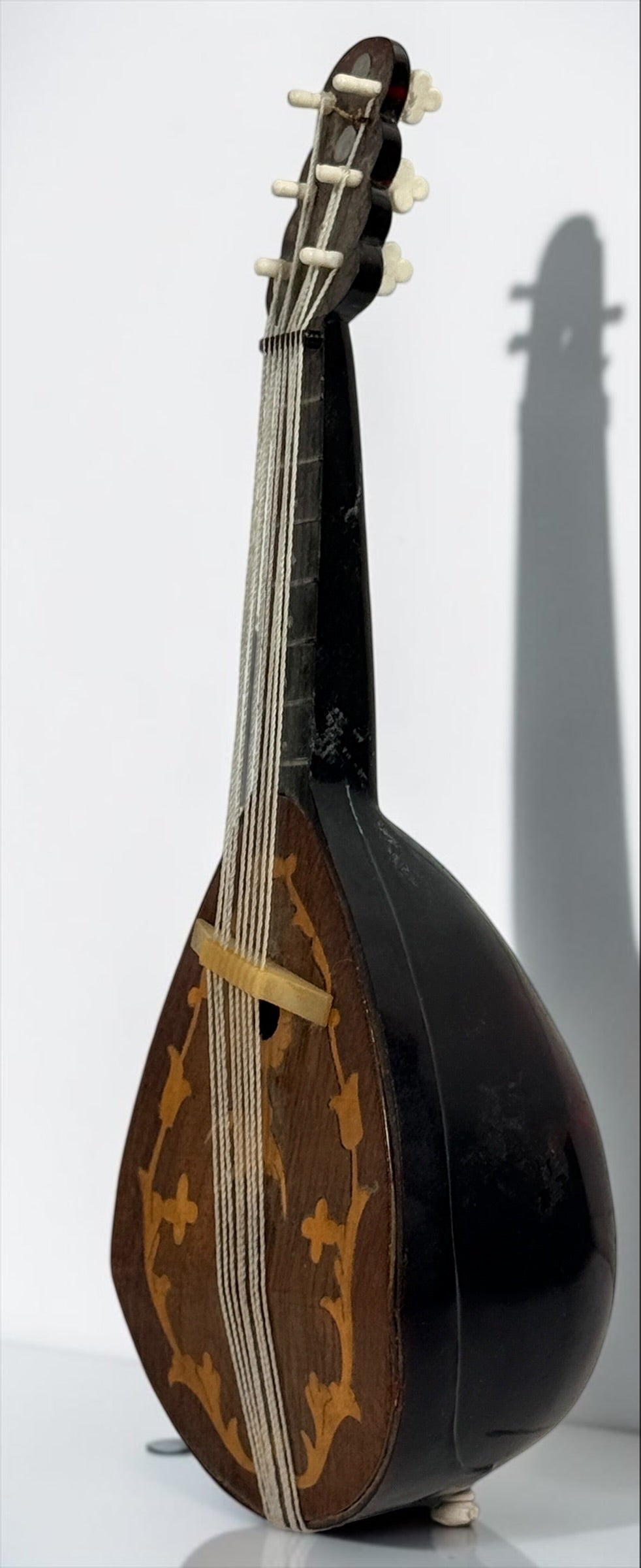 Vintage 1950s TR Made in Italy mandolin-shaped music box from the Isle of Capri featuring beautiful marquetry wood inlay and a classic wind-up musical mechanism.