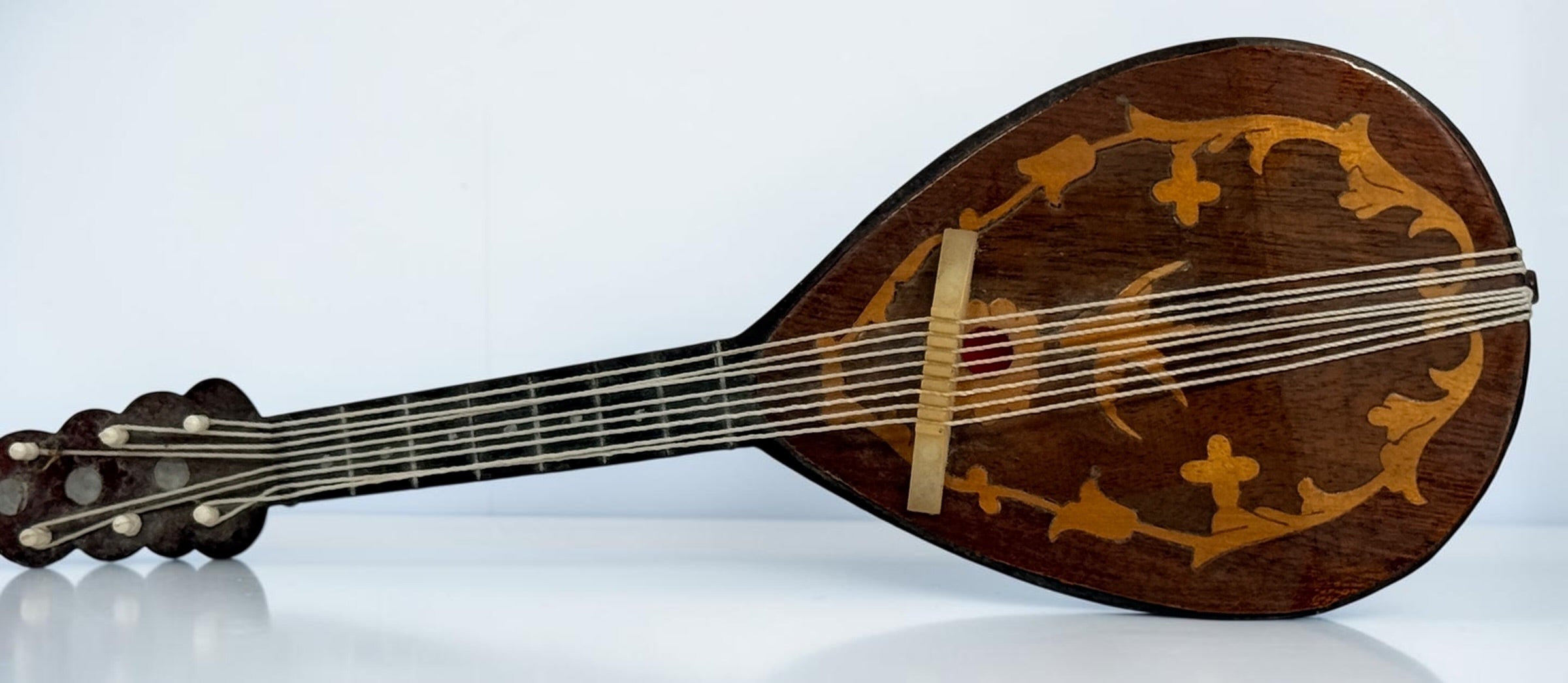 Vintage 1950s TR Made in Italy mandolin-shaped music box from the Isle of Capri featuring beautiful marquetry wood inlay and a classic wind-up musical mechanism.