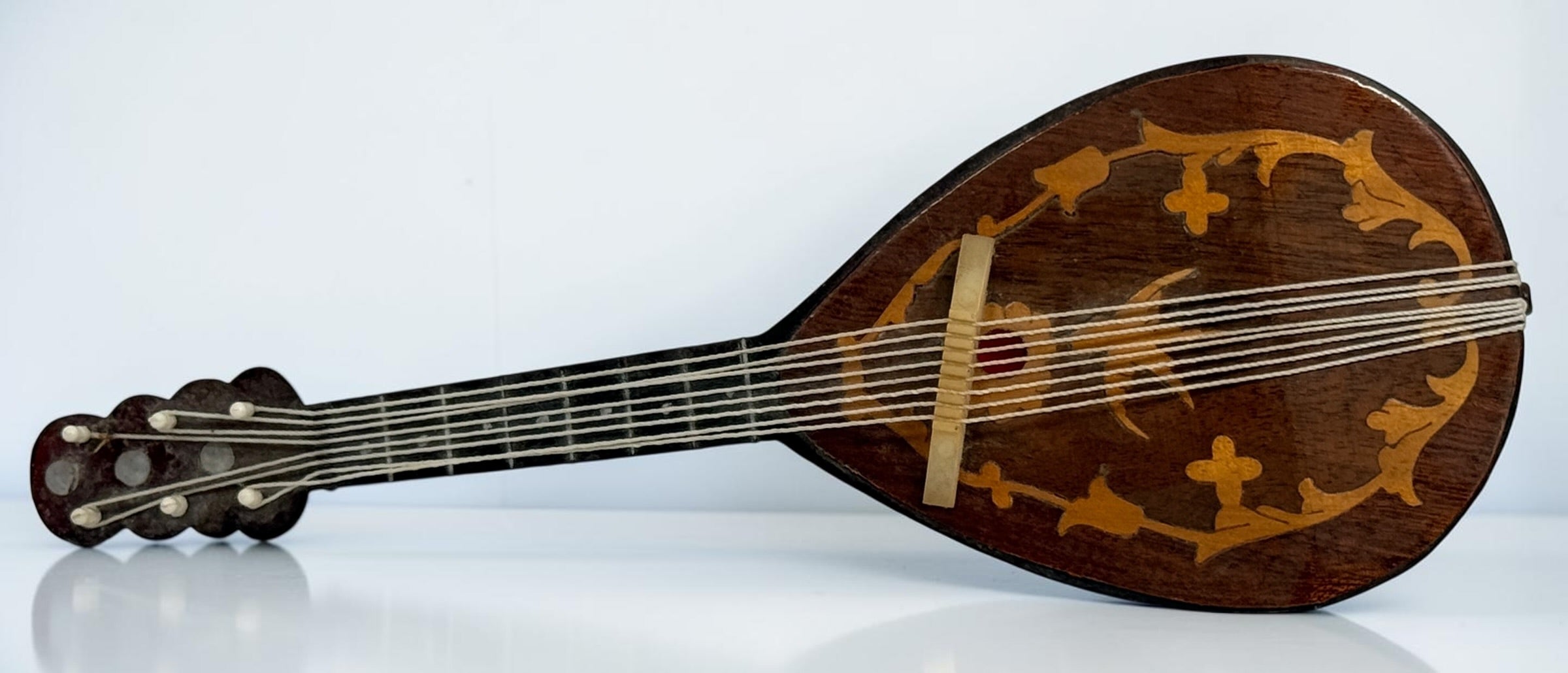 Vintage 1950s TR Made in Italy mandolin-shaped music box from the Isle of Capri featuring beautiful marquetry wood inlay and a classic wind-up musical mechanism.
