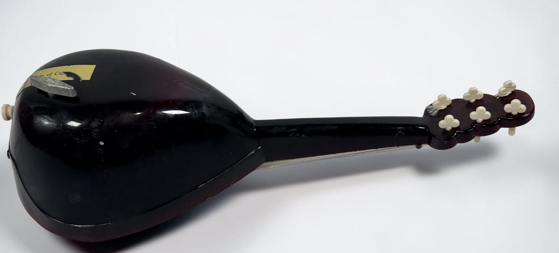 Vintage 1950s TR Made in Italy mandolin-shaped music box from the Isle of Capri featuring beautiful marquetry wood inlay and a classic wind-up musical mechanism.